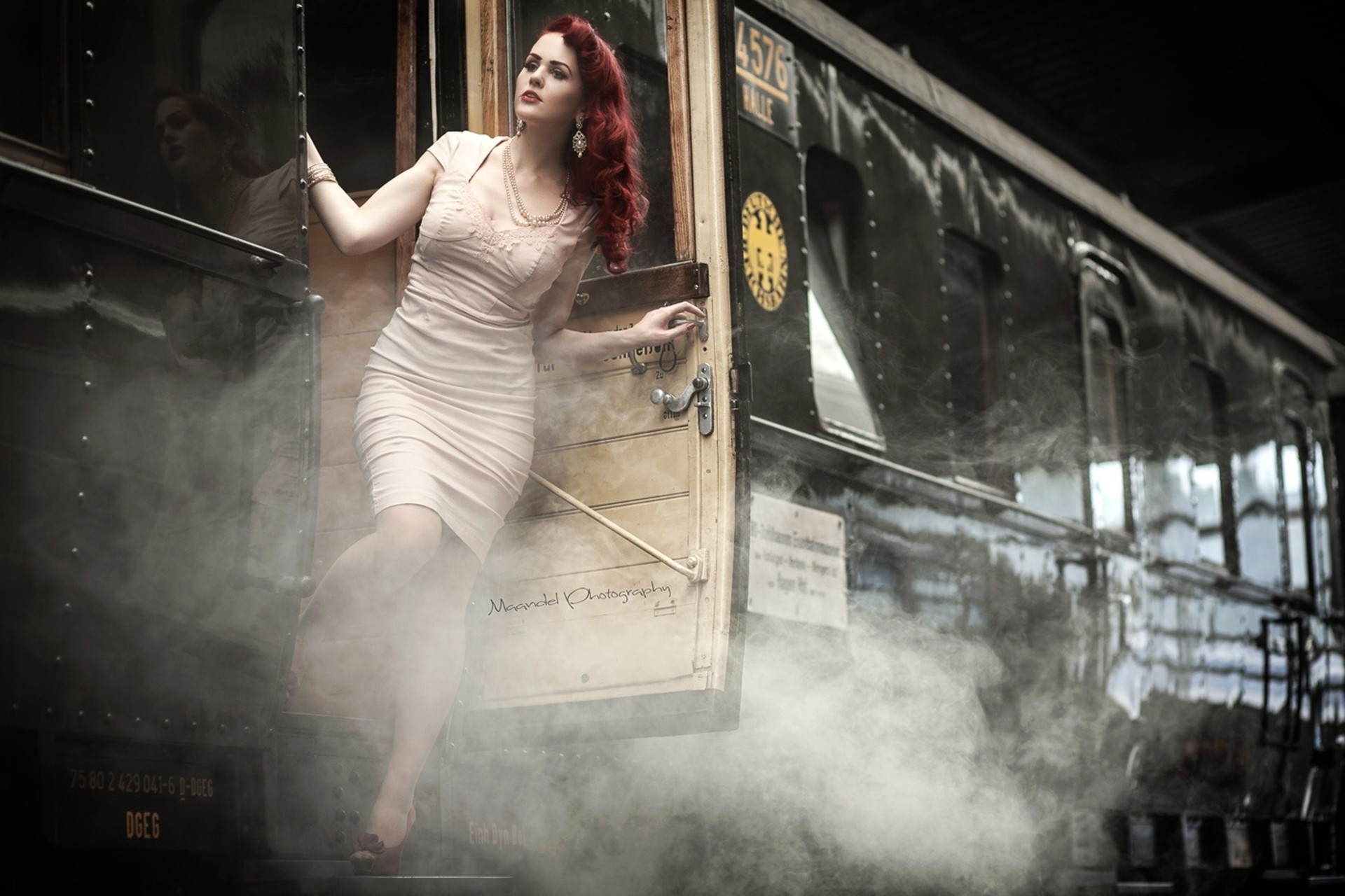 Woman in a dress by a vintage train HD Wallpaper