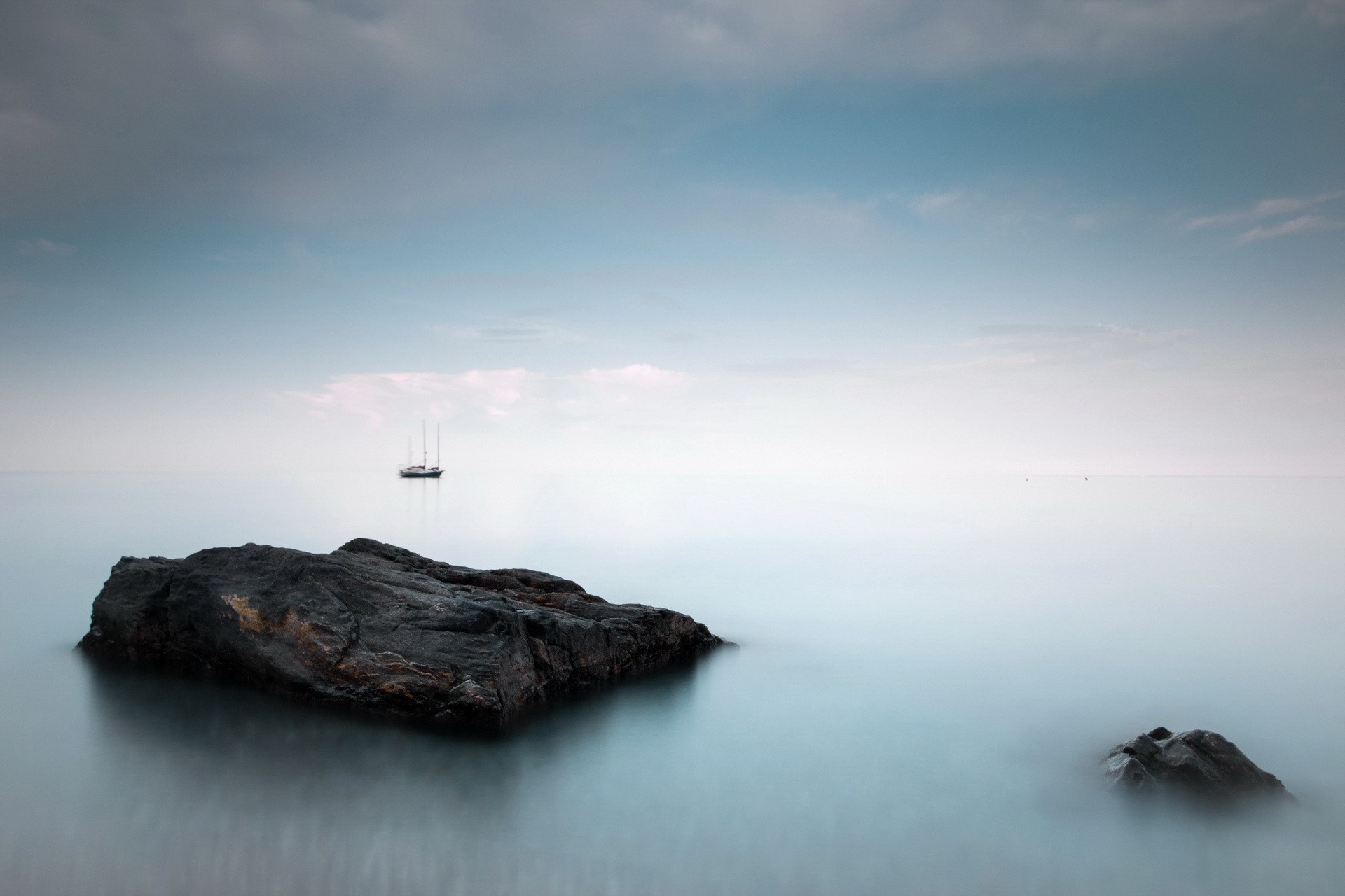 Sailing ship on the sea with rocks and clouds HD Wallpaper