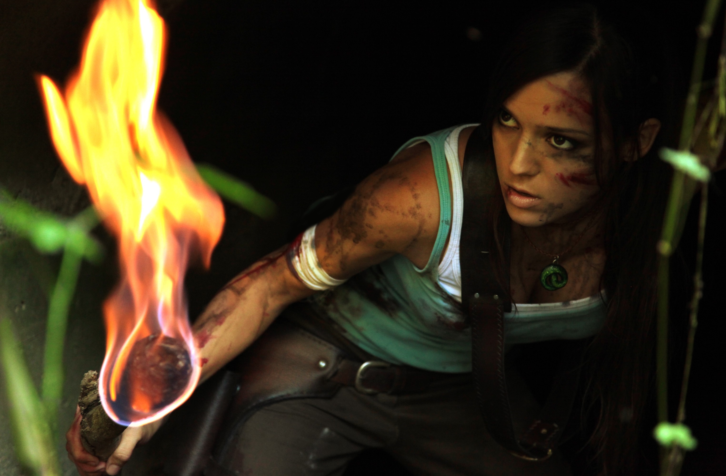 Lara Croft cosplay holding a torch HD Wallpaper