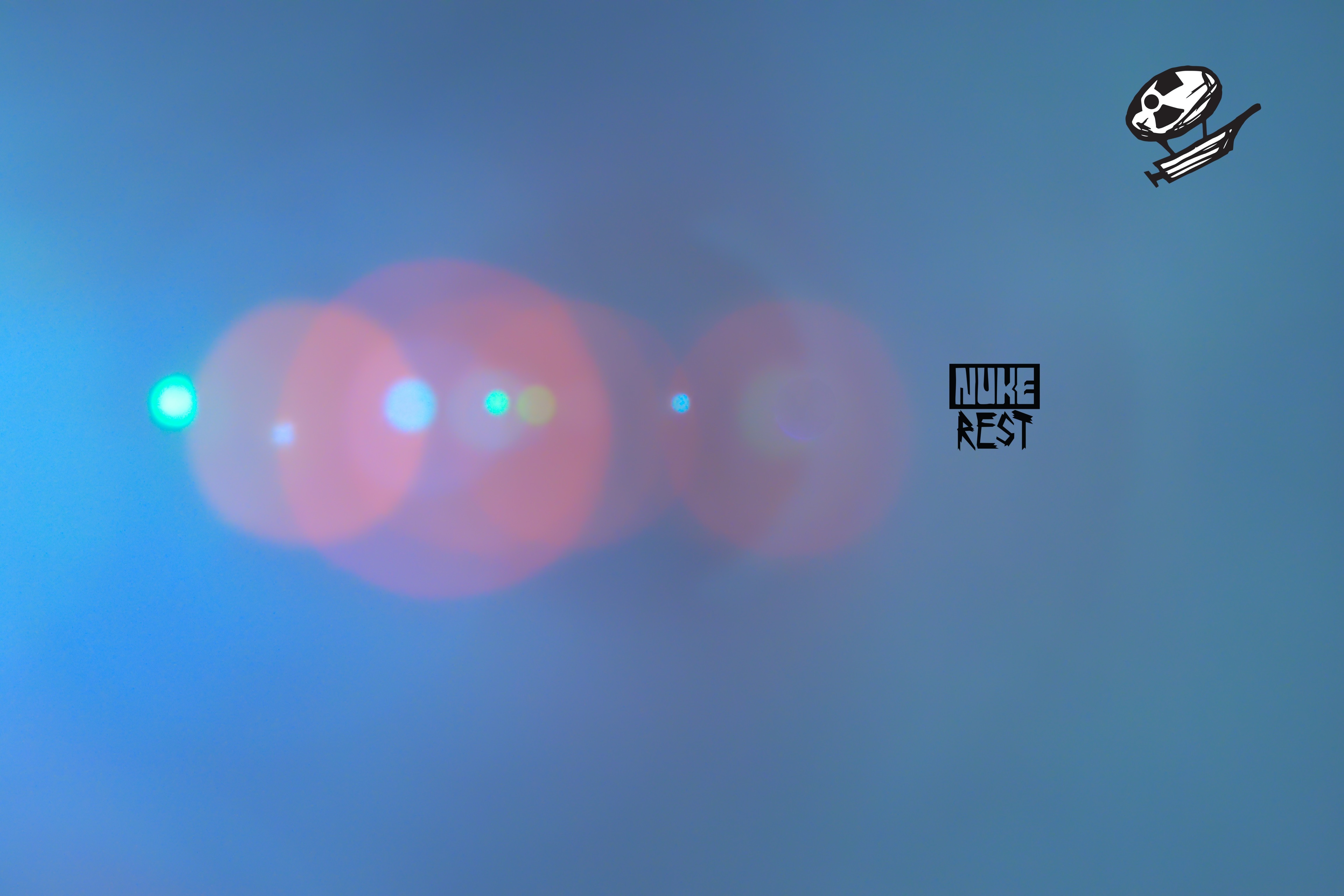 Lens flare with Nuke Rest logo and syringe icon HD Wallpaper