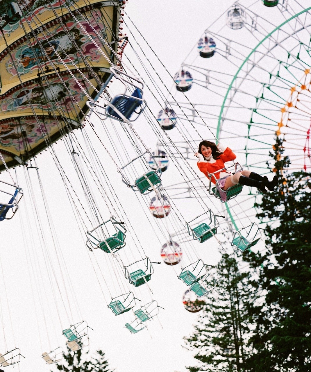 Sasaki Nozomi on a swing ride at an amusement park HD Wallpaper