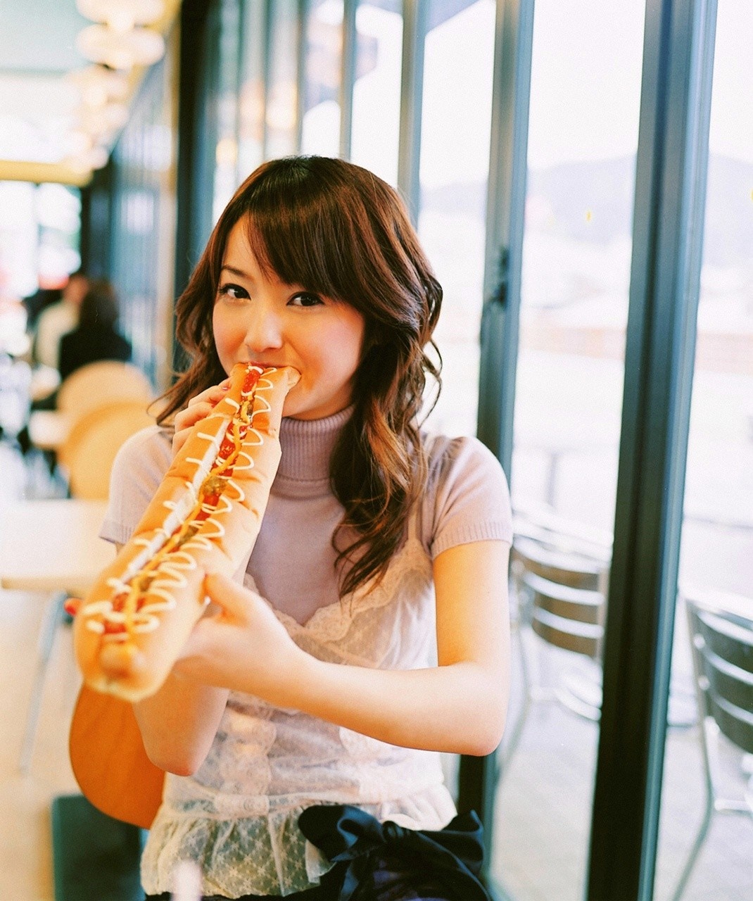 Sasaki Nozomi eating a long hot dog HD Wallpaper