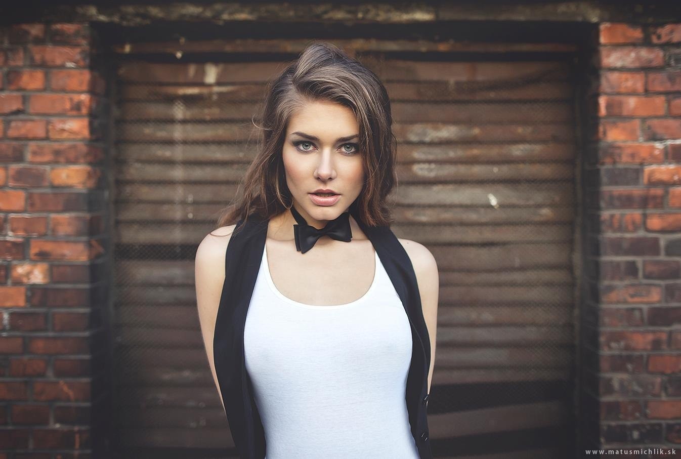 Woman in white tank top and black vest with bow tie HD Wallpaper