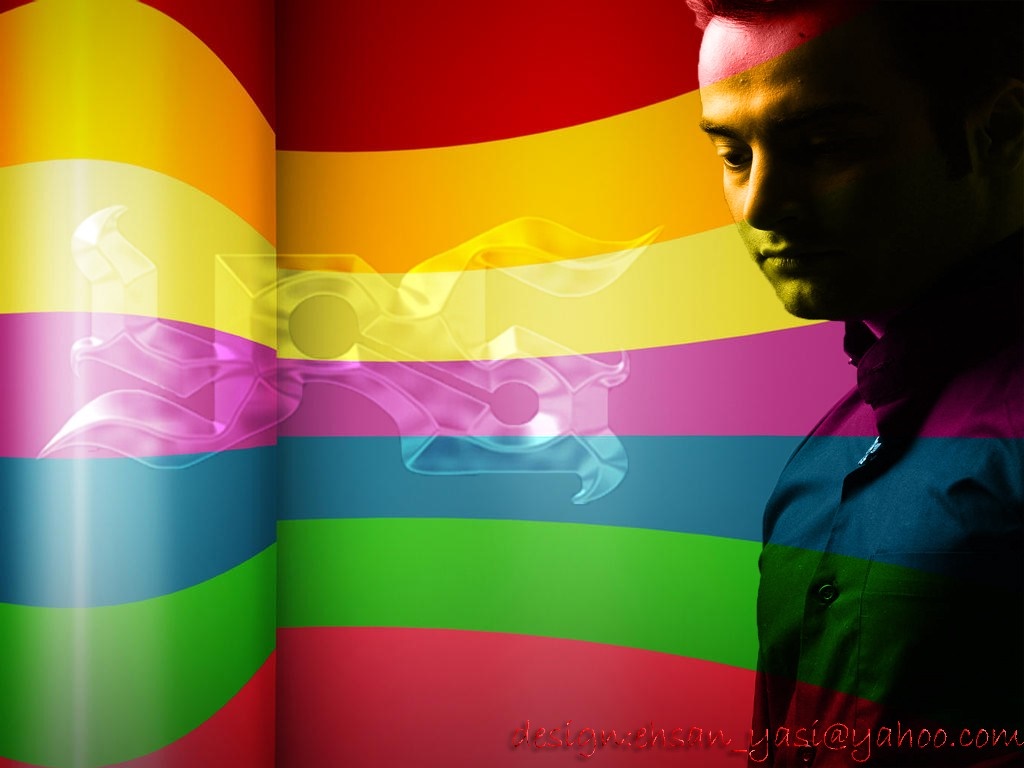 Man against a rainbow background with a logo HD Wallpaper