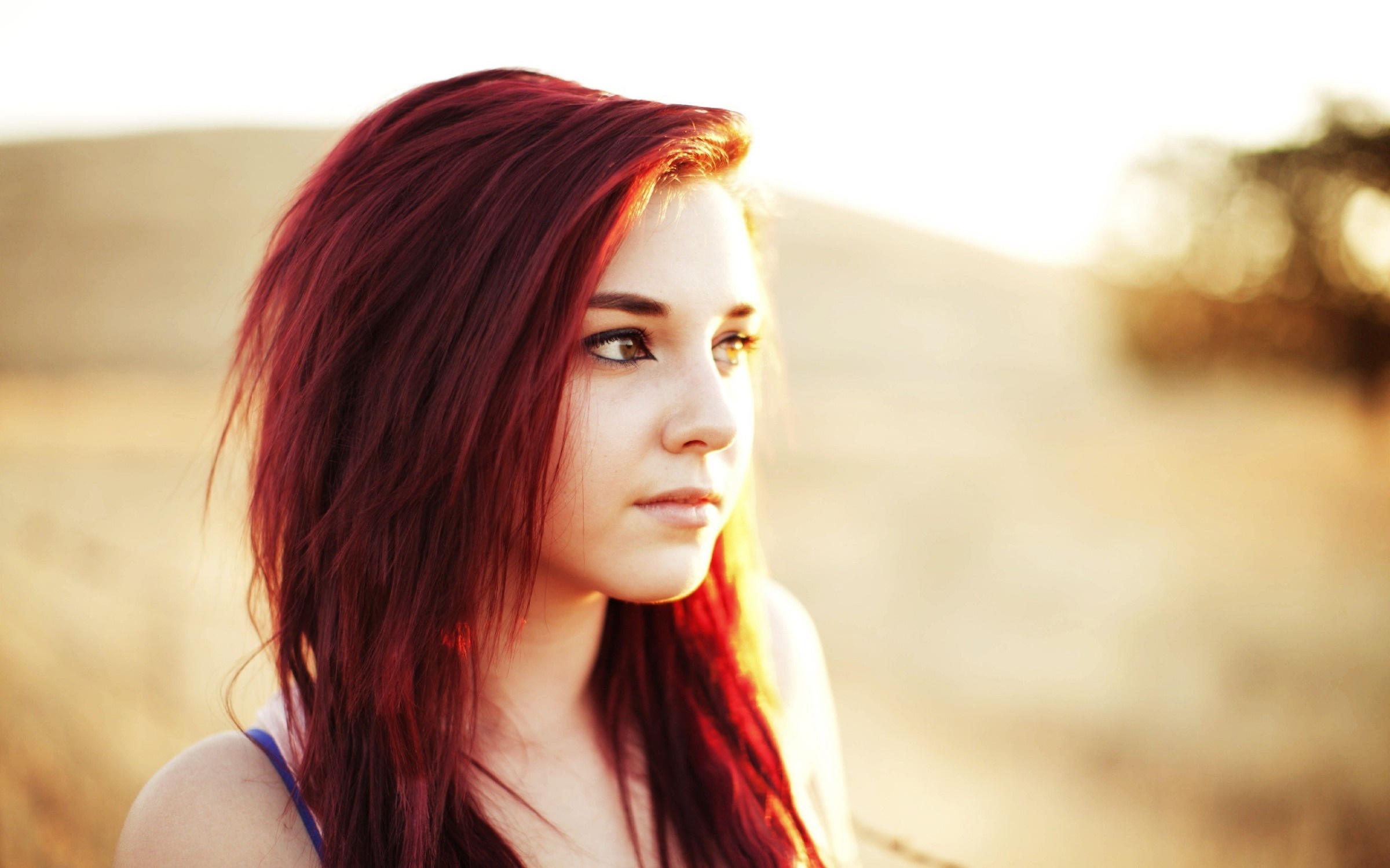 Portrait of a Young Woman with Red Hair in Sunlight HD Wallpaper