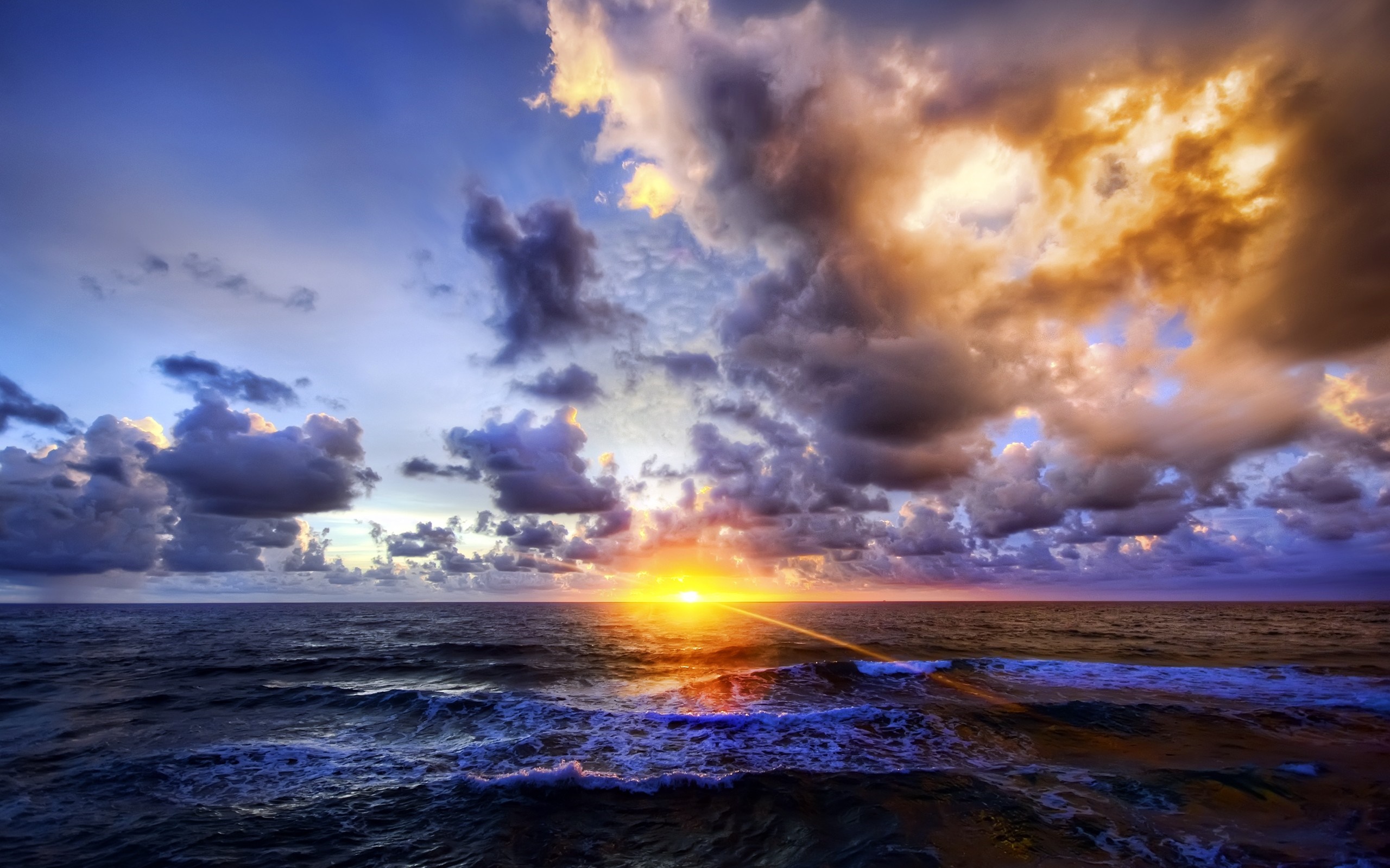 Sunset over the ocean with dramatic clouds HD Wallpaper
