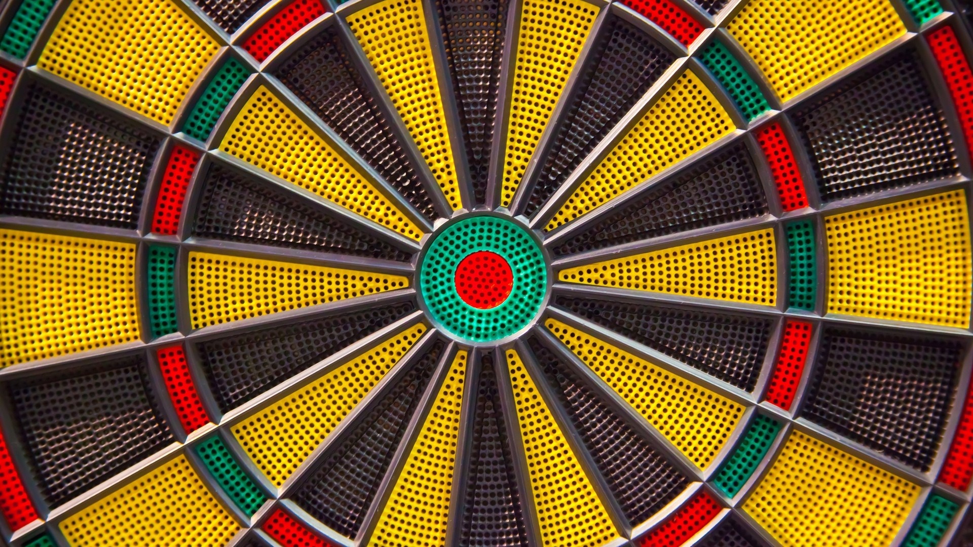 Close-up of a colorful dartboard with a bullseye HD Wallpaper