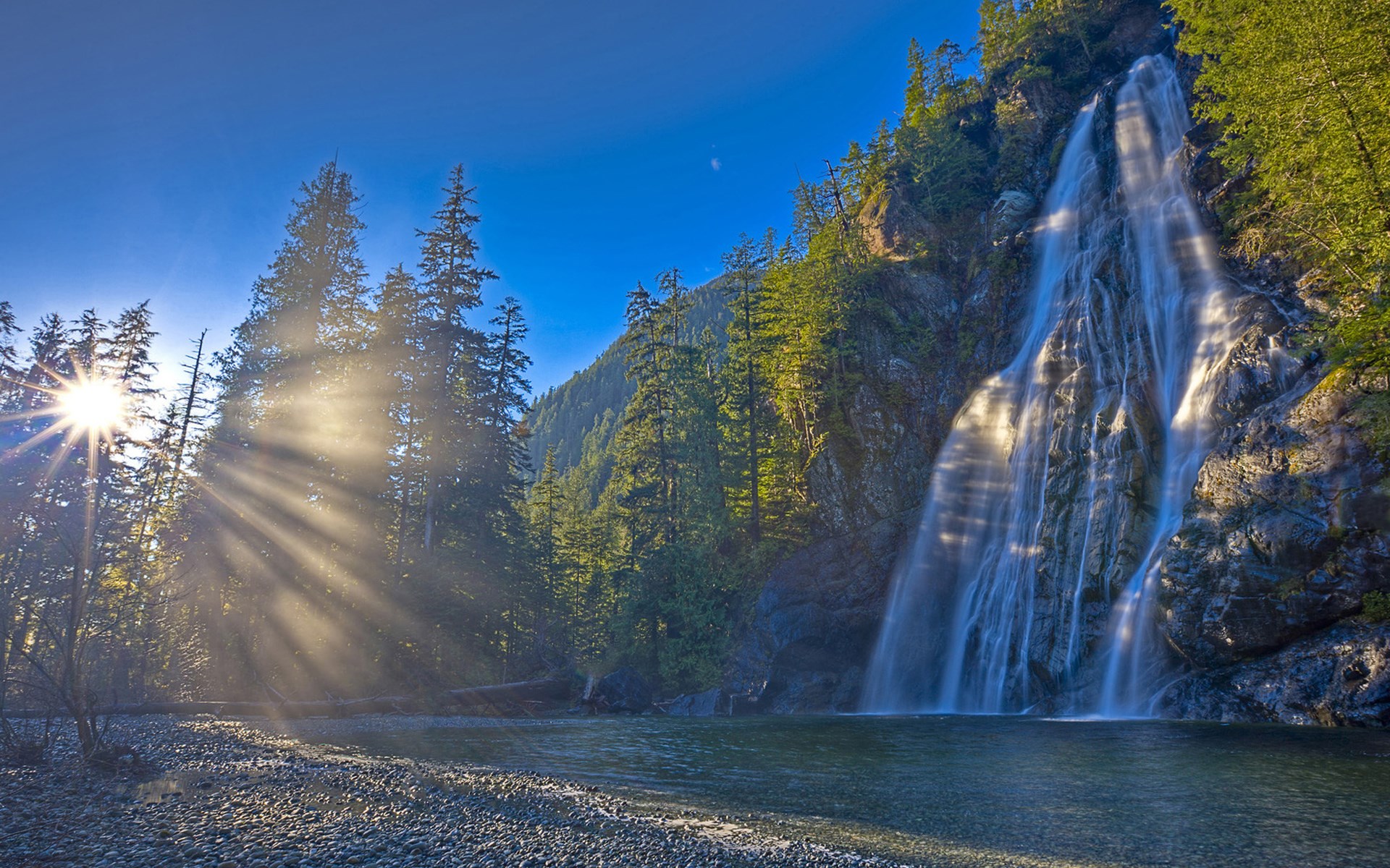 Waterfall in a Forest with Sunbeams HD Wallpaper