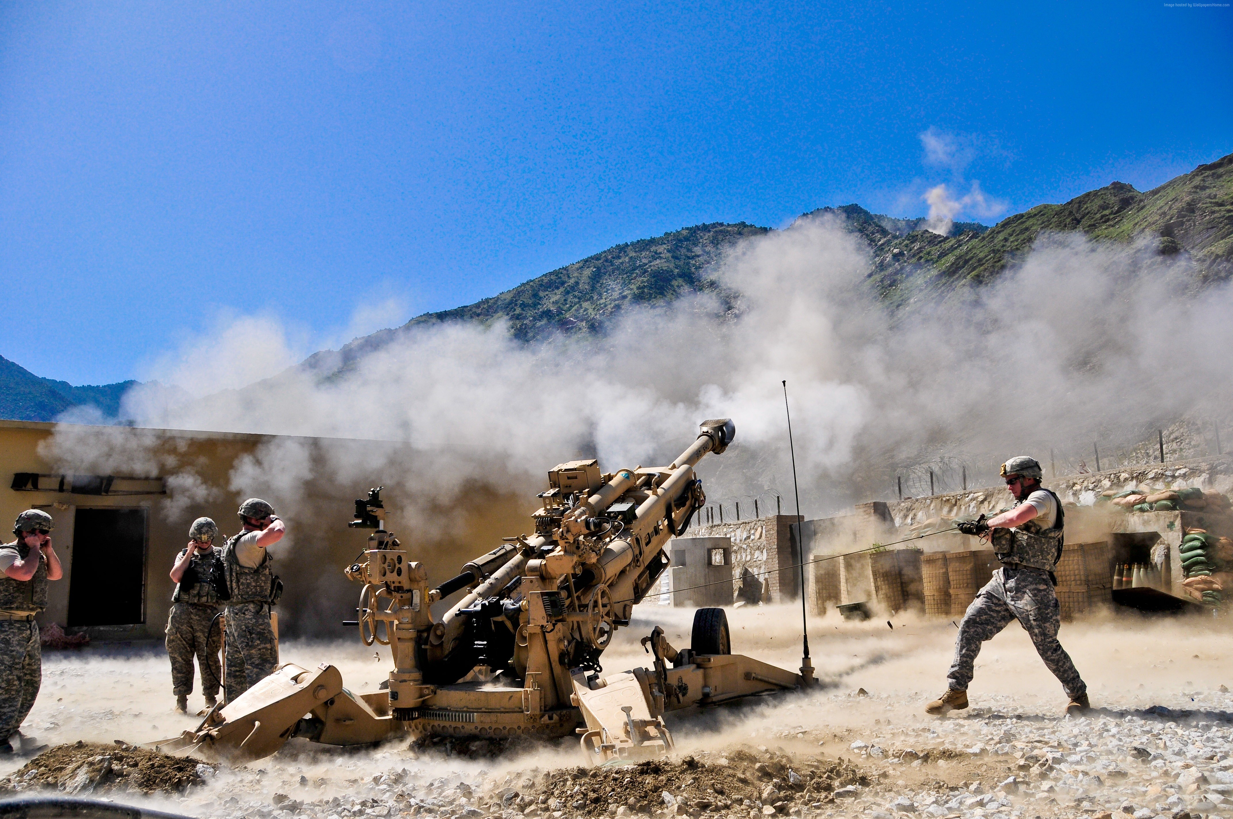 US Army soldiers firing artillery in a mountainous region HD Wallpaper