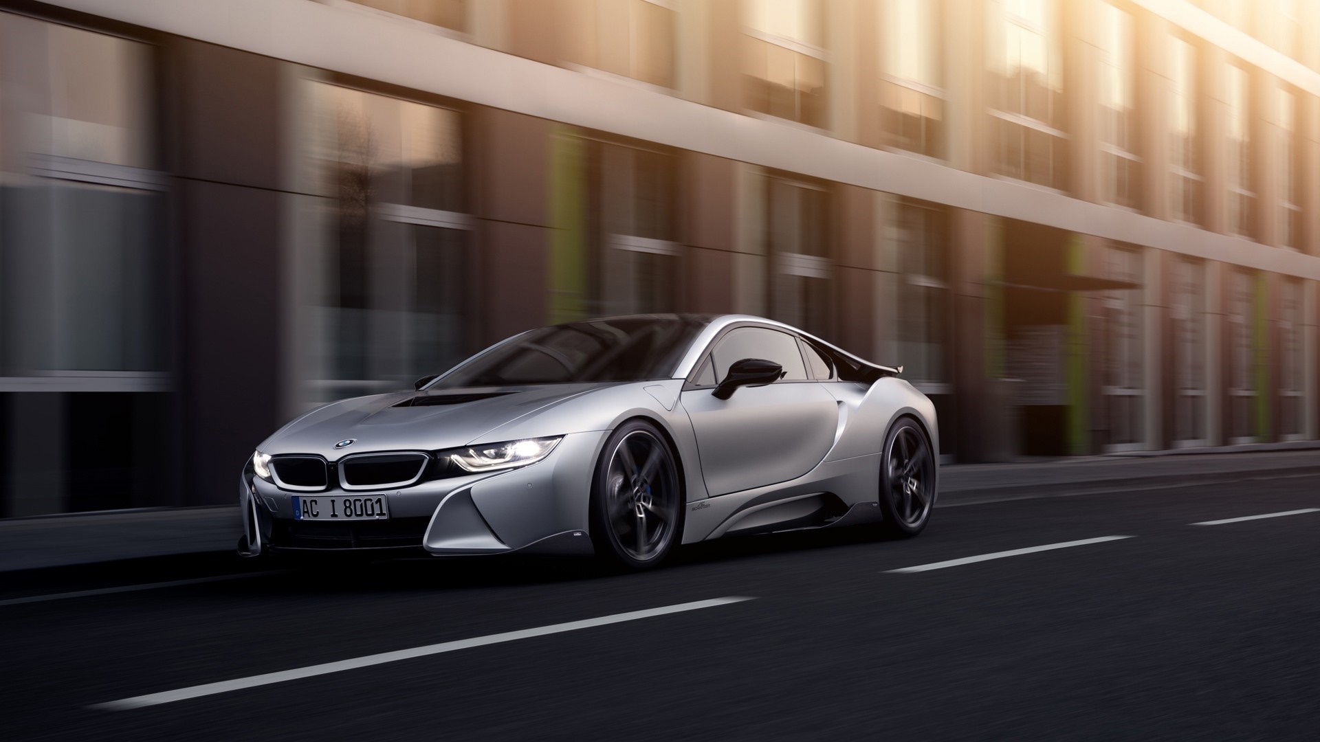 Silver BMW i8 AC Schnitzer driving on a city street HD Wallpaper
