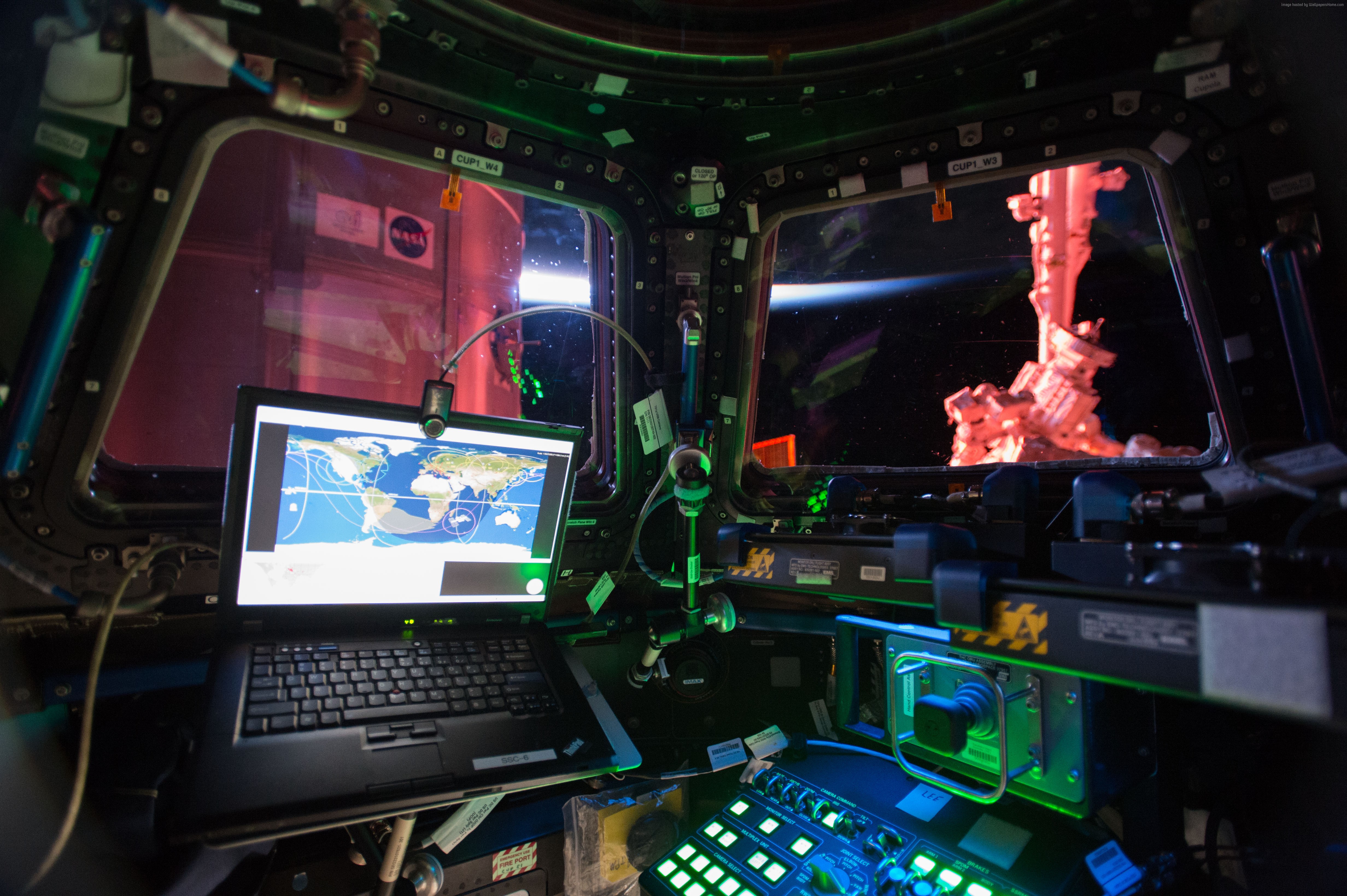 Laptop and Earth view from ISS Cupola HD Wallpaper