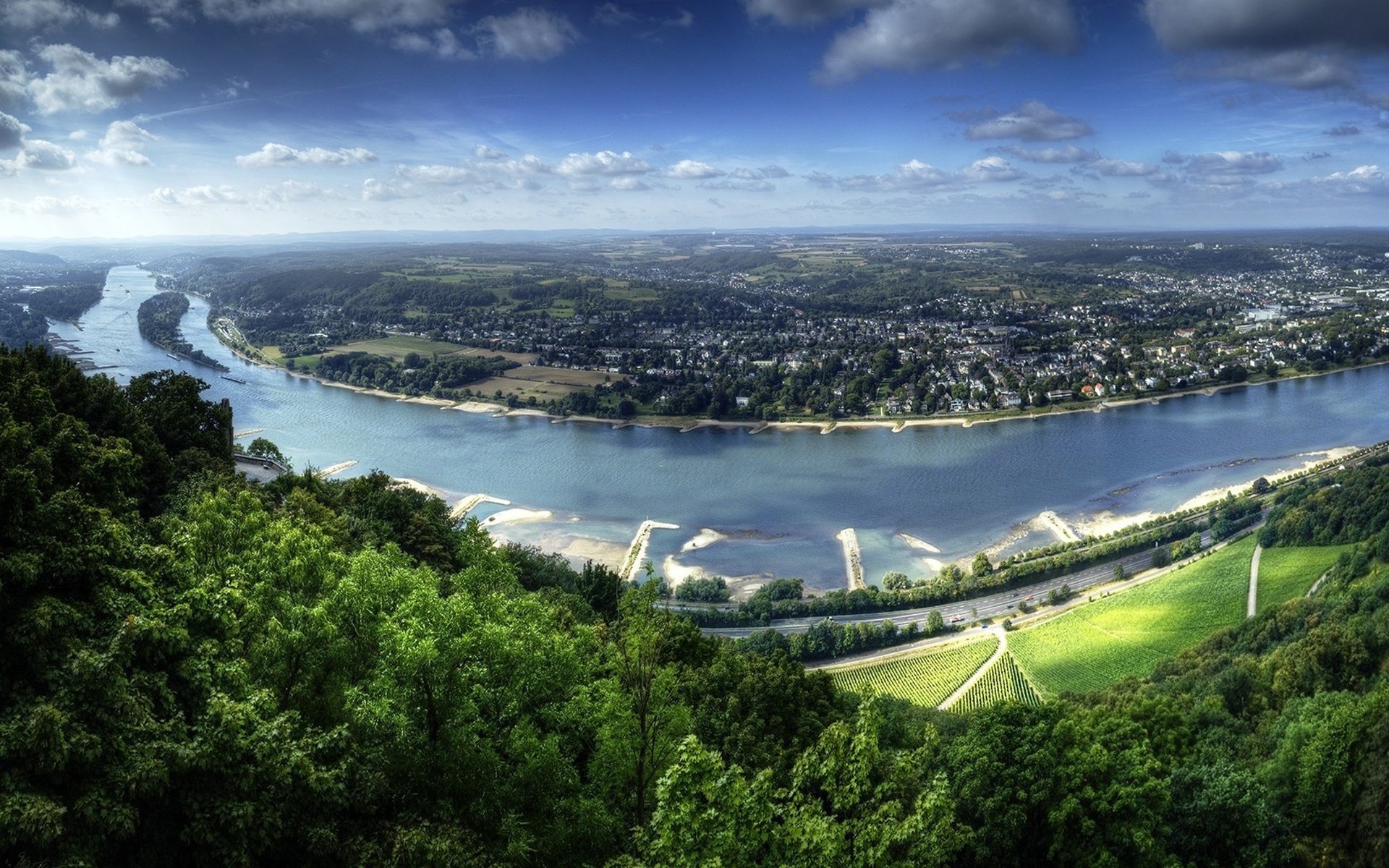River bend with city and vineyards from a hilltop HD Wallpaper