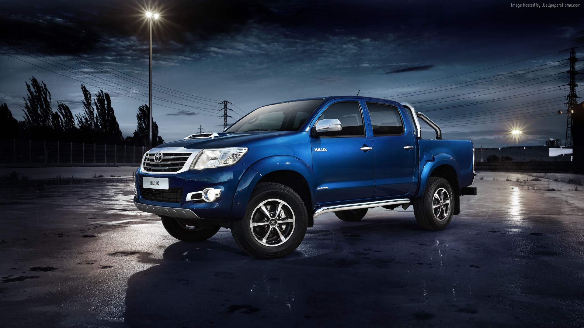 Blue Toyota Hilux Invincible pickup truck at night HD Wallpaper