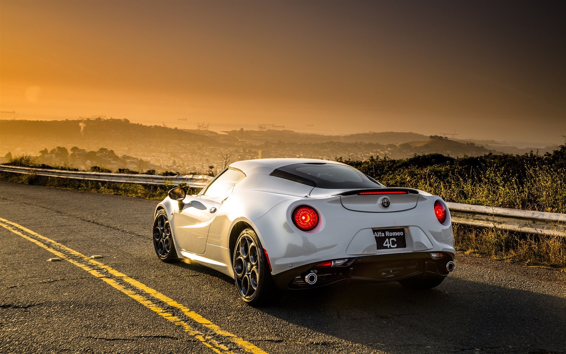 White Alfa Romeo 4C sports car on a road at sunset HD Wallpaper