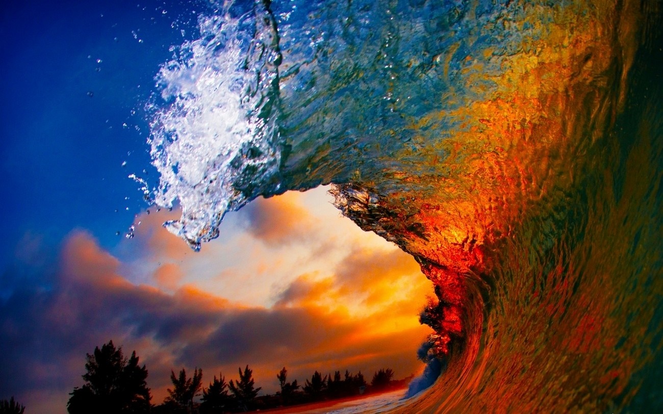 Wave crashing at sunset with colorful sky HD Wallpaper