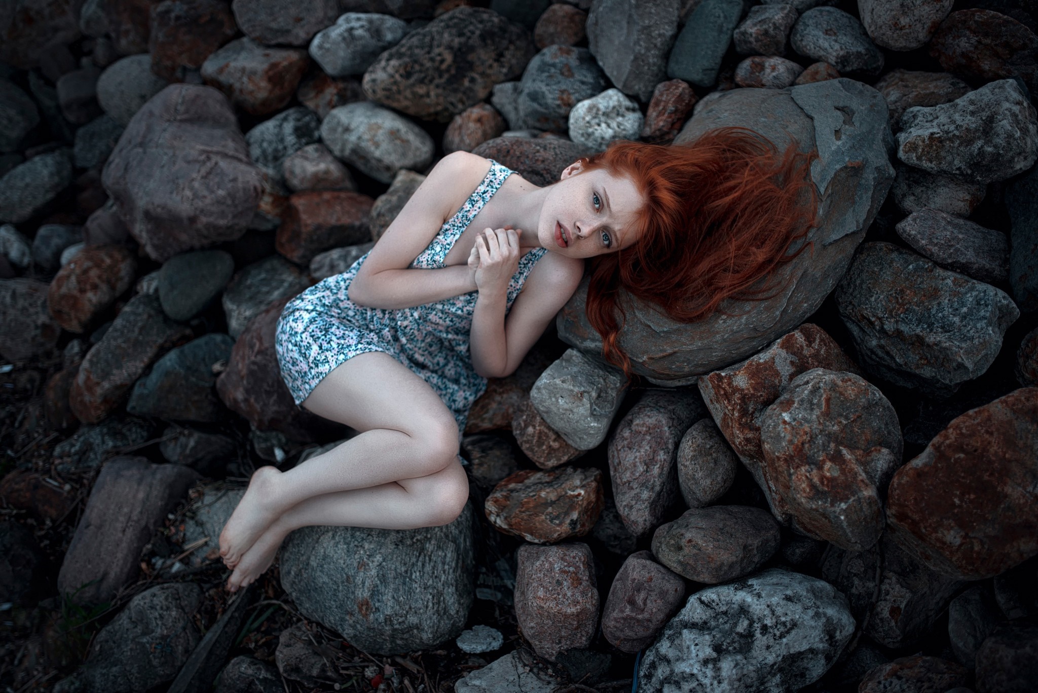 Redhead woman lying on rocks HD Wallpaper