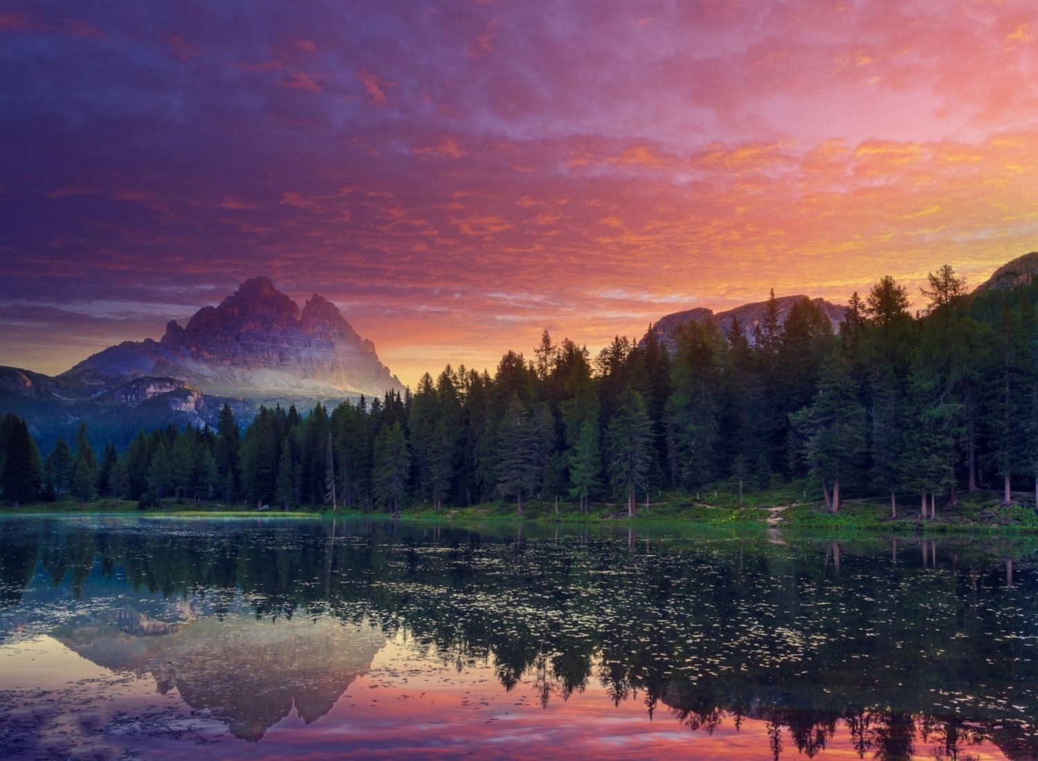 Mountain lake at sunset with colorful sky and forest reflection HD Wallpaper