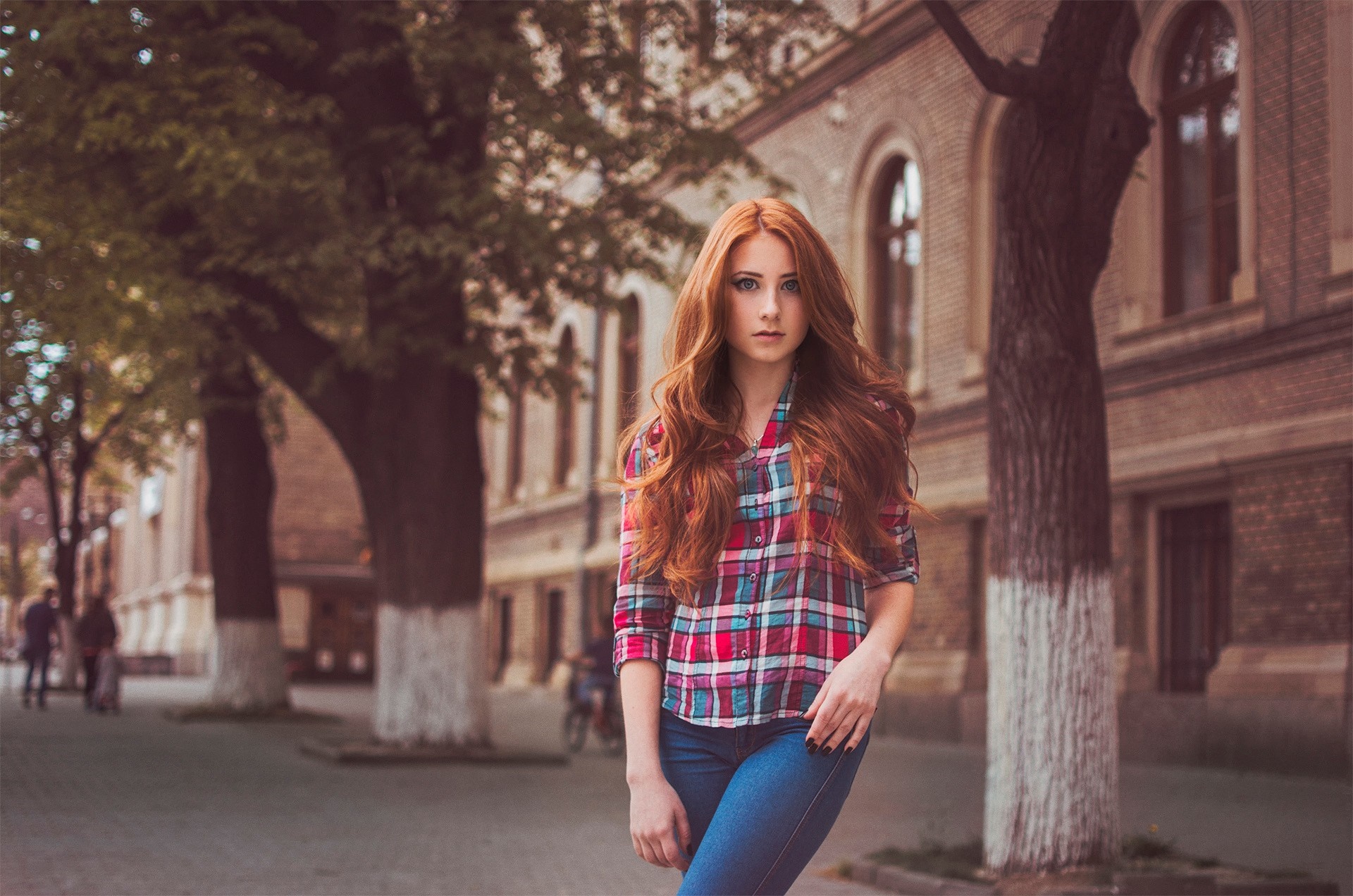 Redhead woman in plaid shirt and jeans on street HD Wallpaper