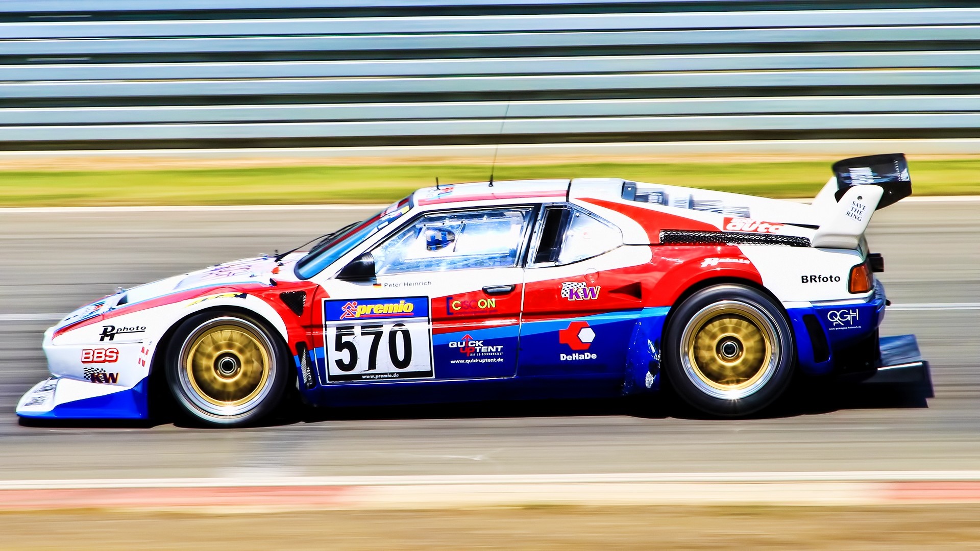 BMW M1 race car with number 570 on a race track HD Wallpaper