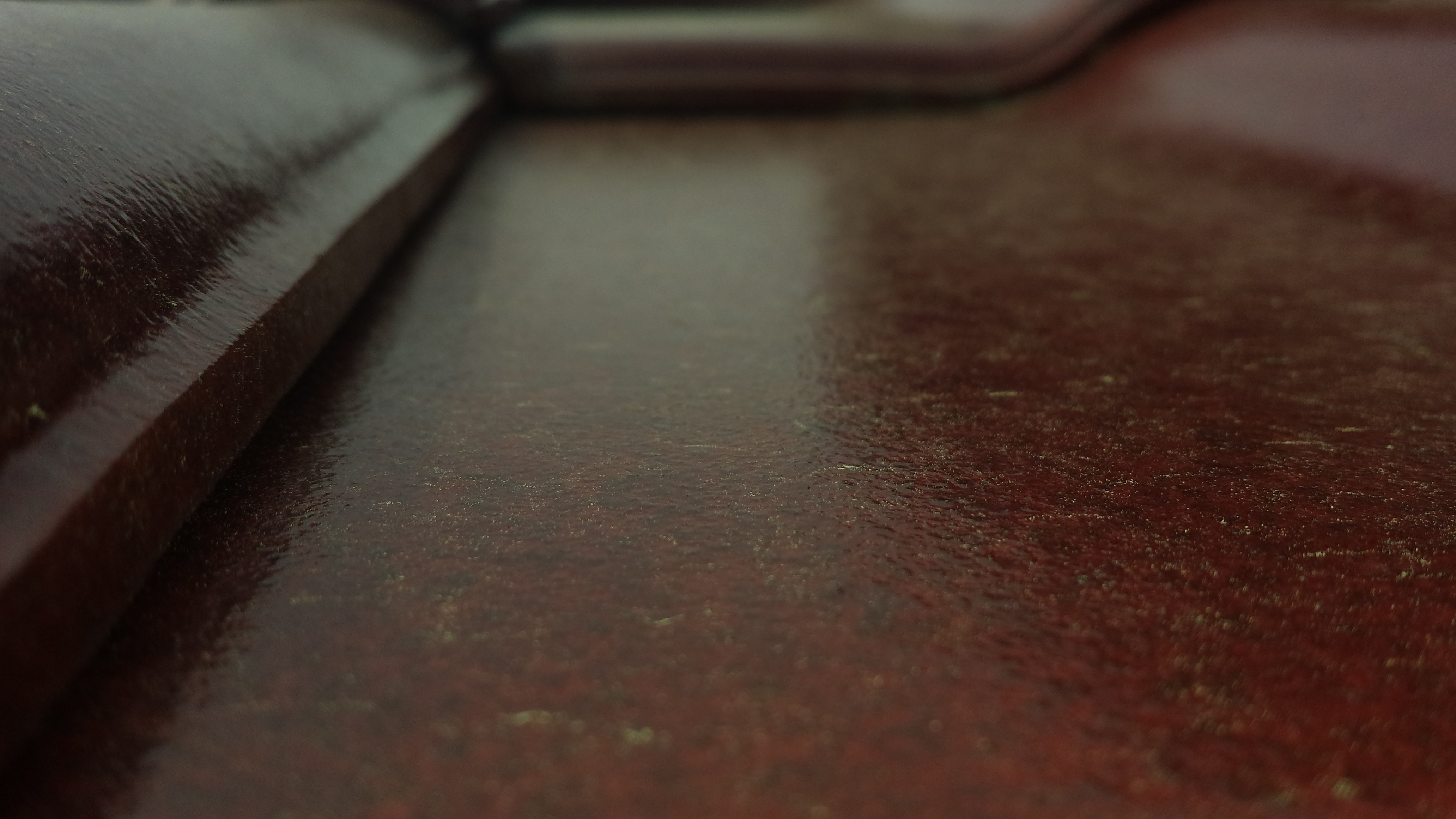 Close-up of a textured red-brown wooden surface HD Wallpaper