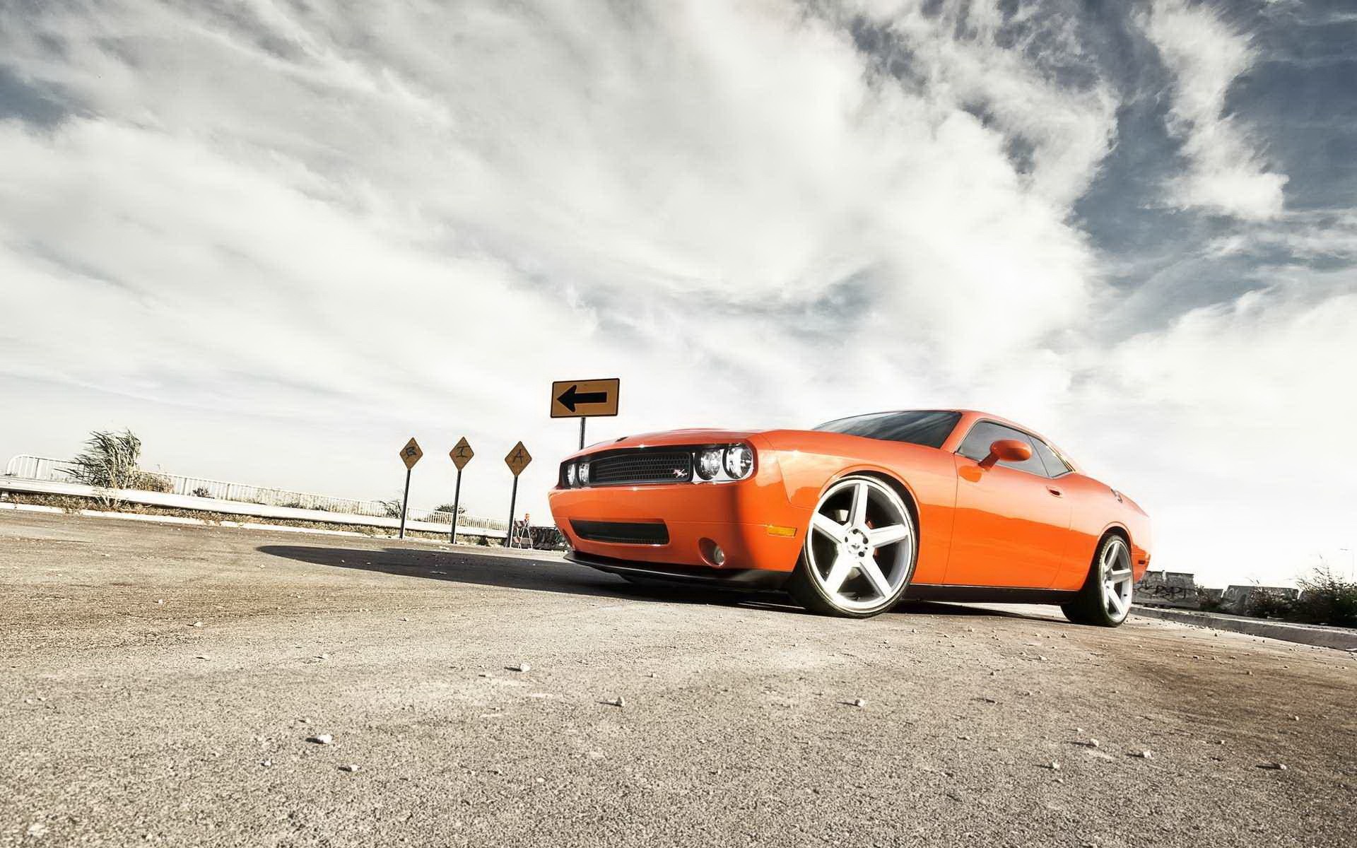 Orange Dodge Challenger SRT on a dirt road HD Wallpaper