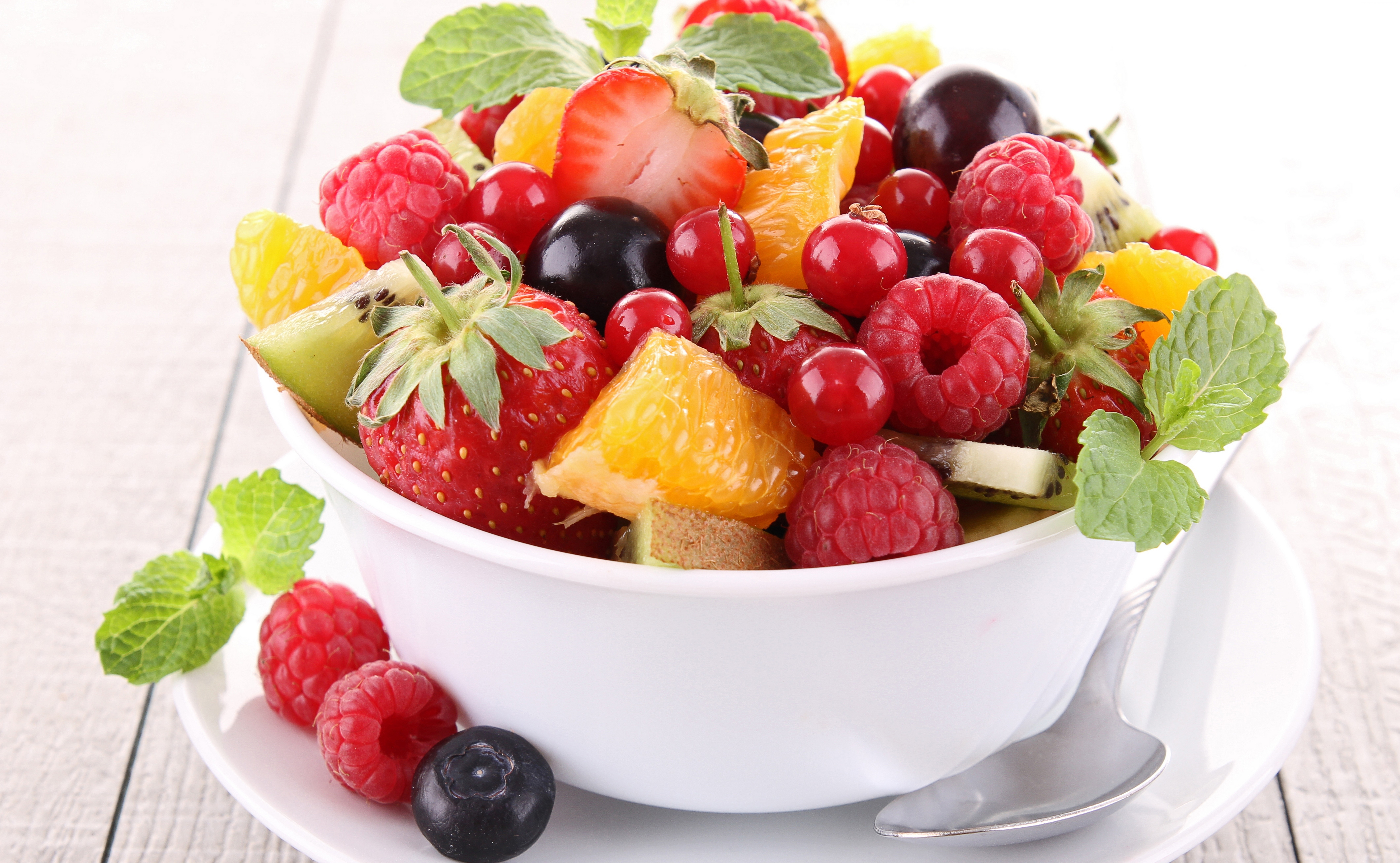 Fruit salad with strawberries, raspberries, blueberries, oranges, kiwi, and mint HD Wallpaper