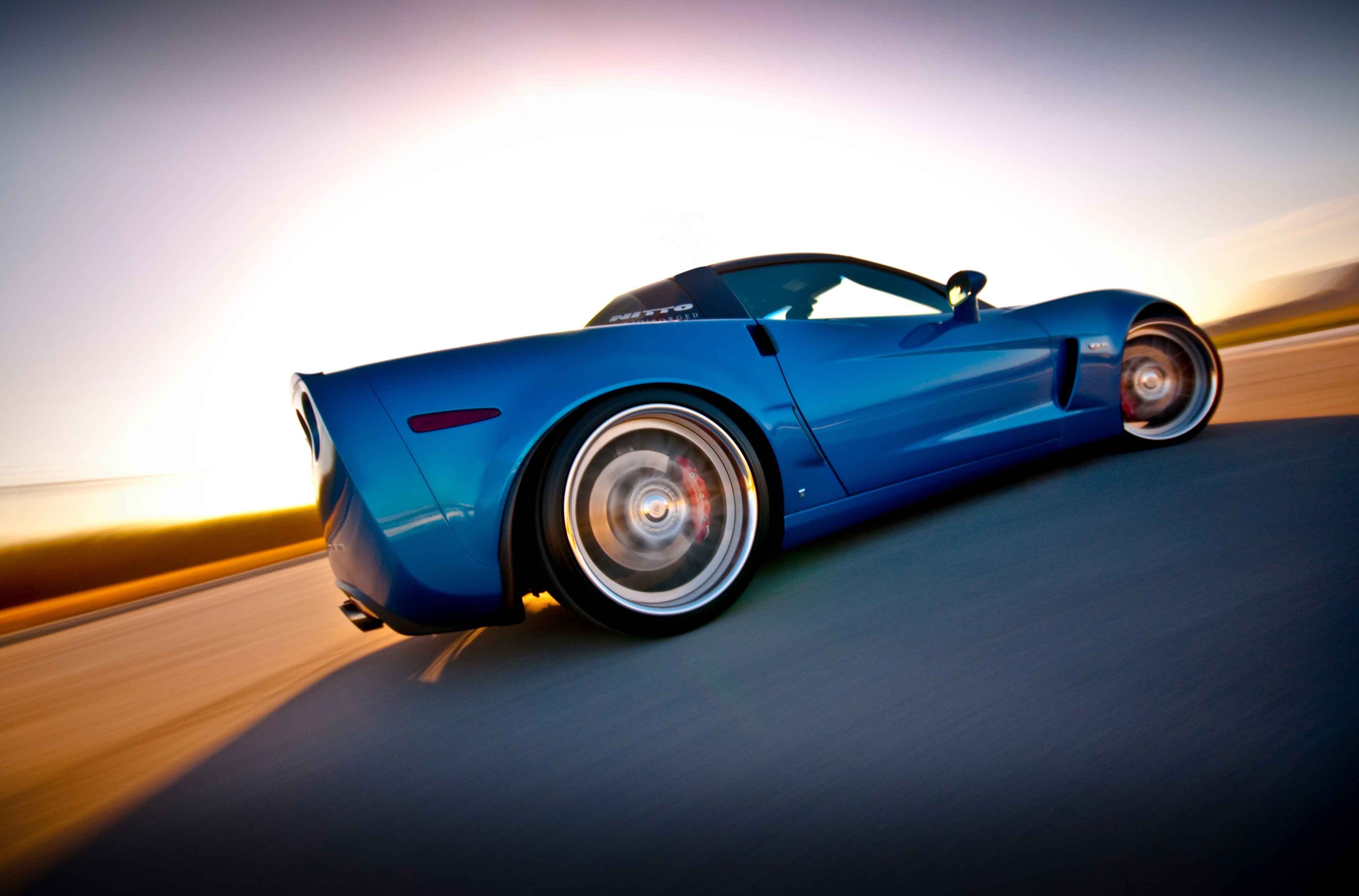 Blue Chevrolet Corvette driving on a road HD Wallpaper