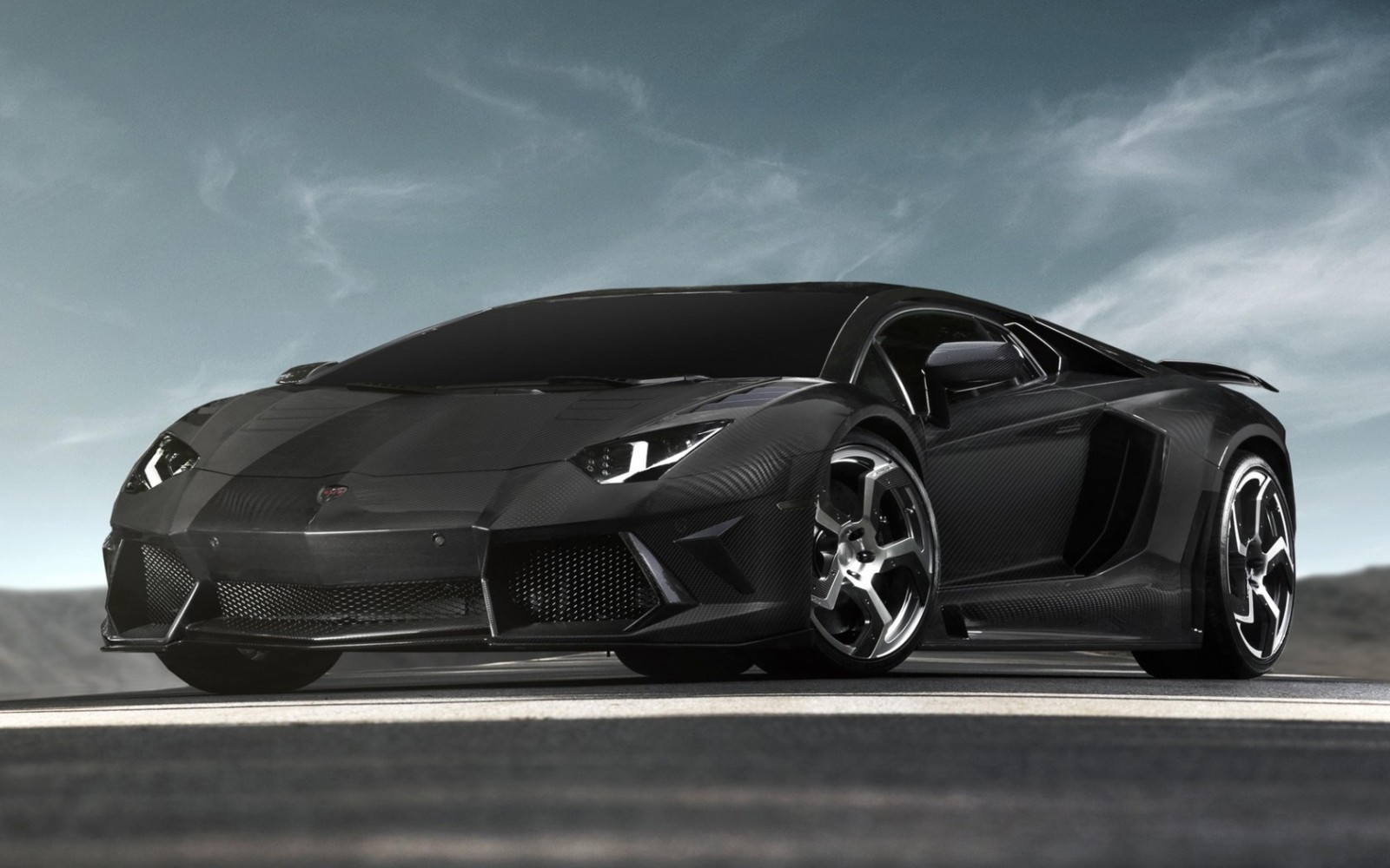 Black Lamborghini Aventador SVJ on a road HD Wallpaper