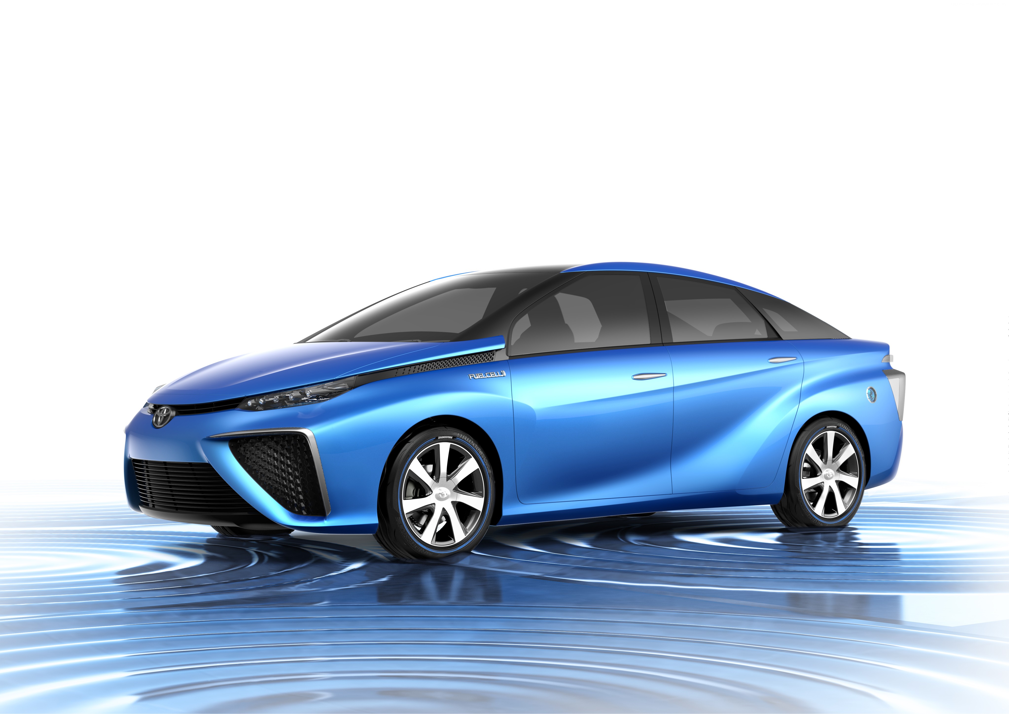 Blue Toyota FCV sedan on water ripples HD Wallpaper