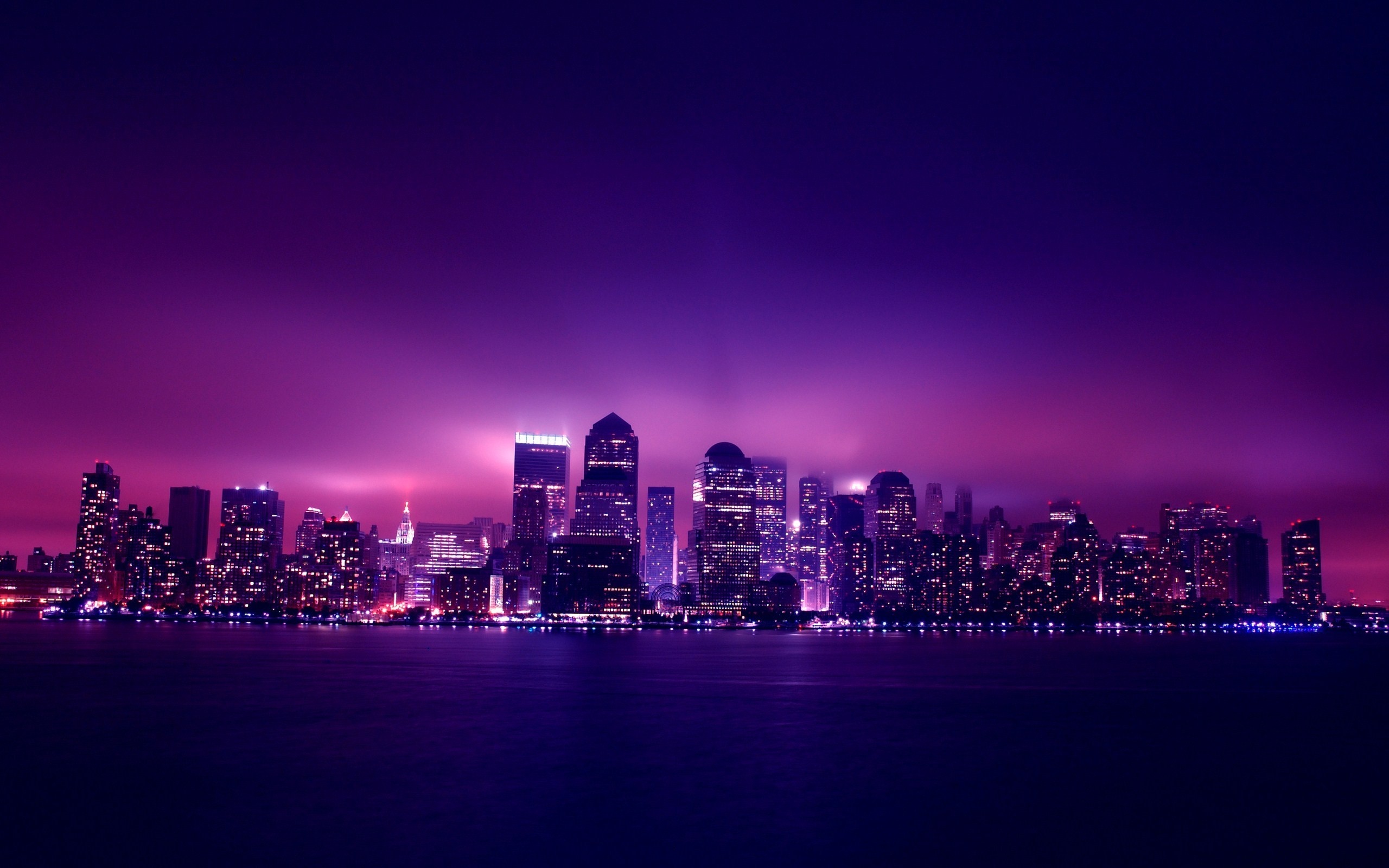 Purple Skyline Cityscape at Night Over Water HD Wallpaper