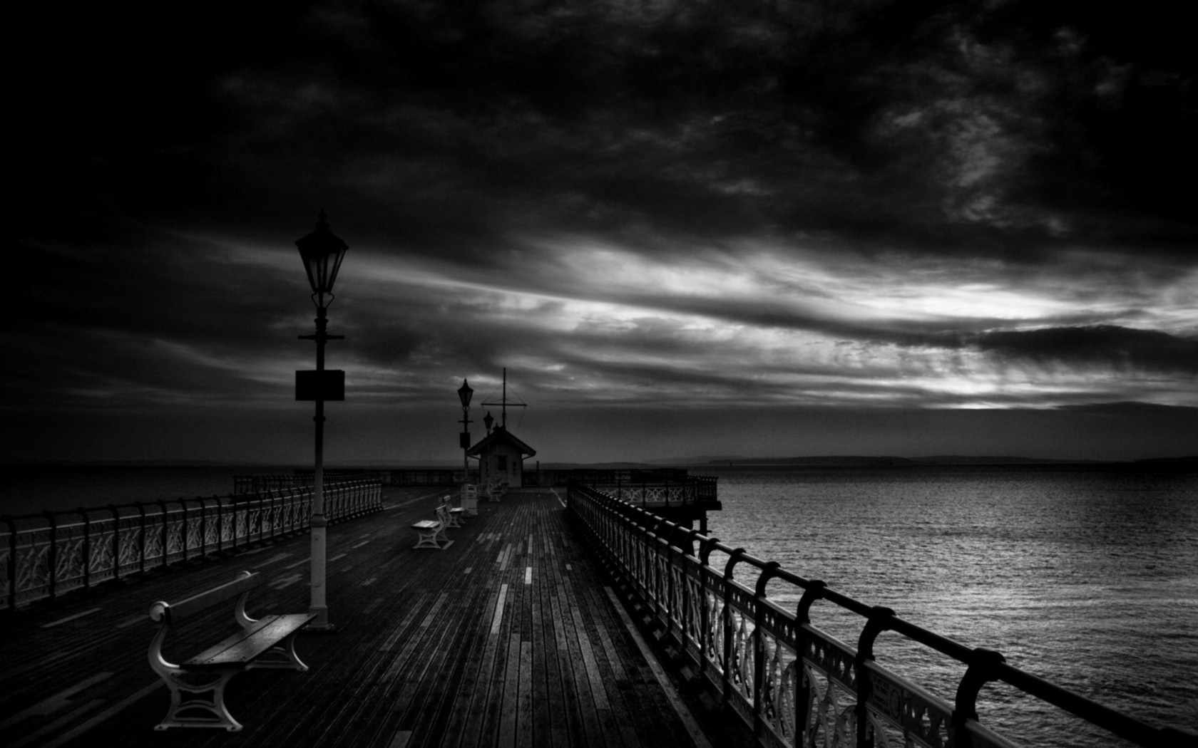 Pier with benches and lampposts at dusk HD Wallpaper