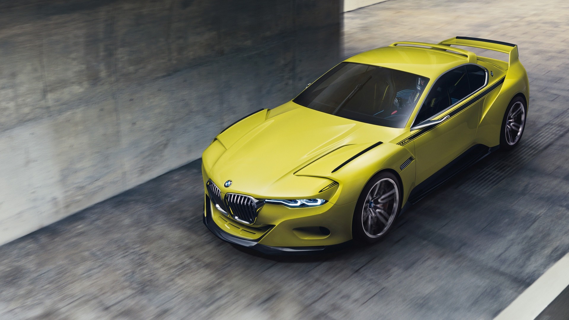 Yellow BMW 3.0 CSL concept car on a road HD Wallpaper