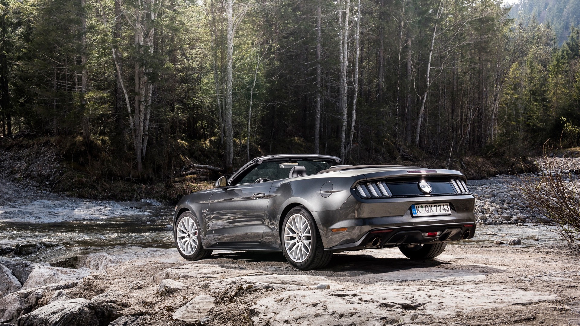 Gray Ford Mustang Convertible parked by a forest stream HD Wallpaper