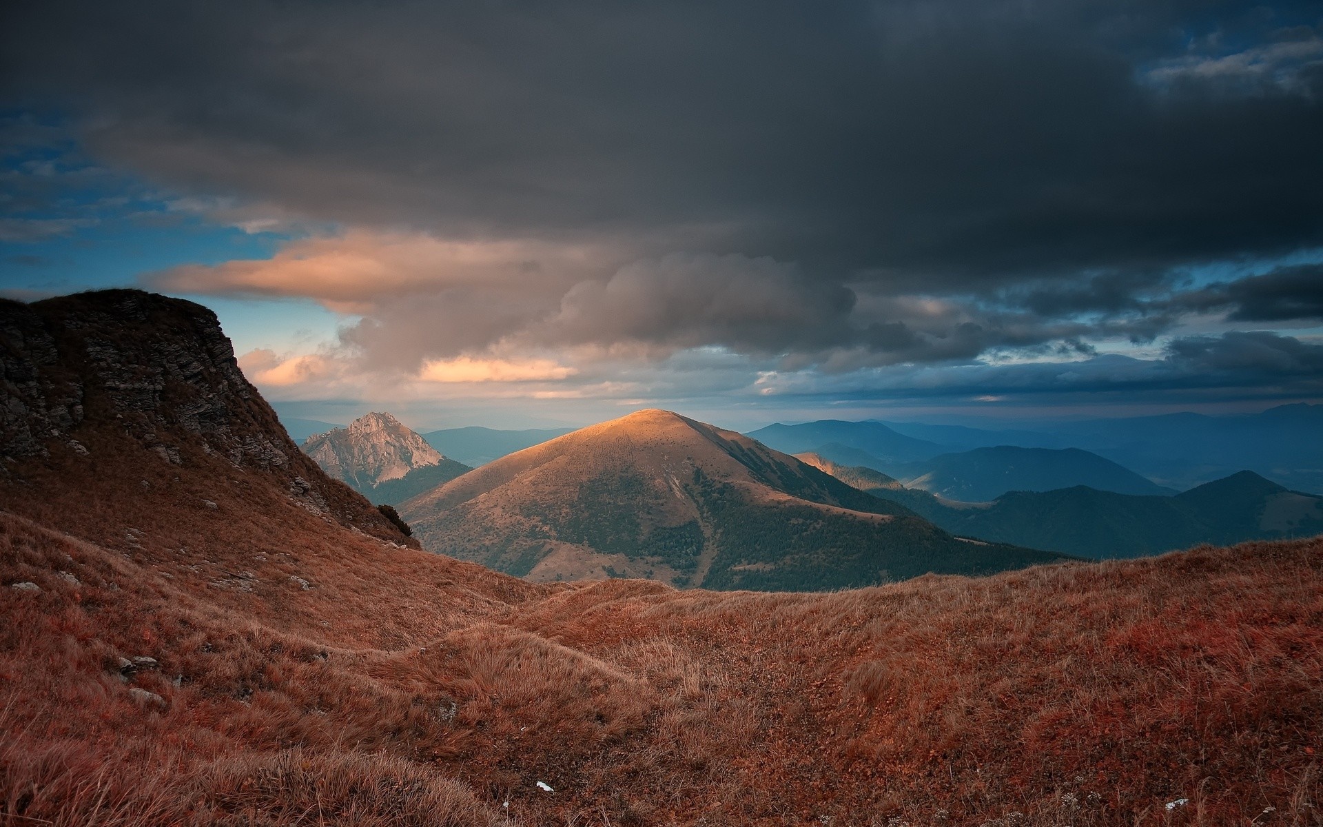Mountain landscape at sunset with dramatic clouds HD Wallpaper