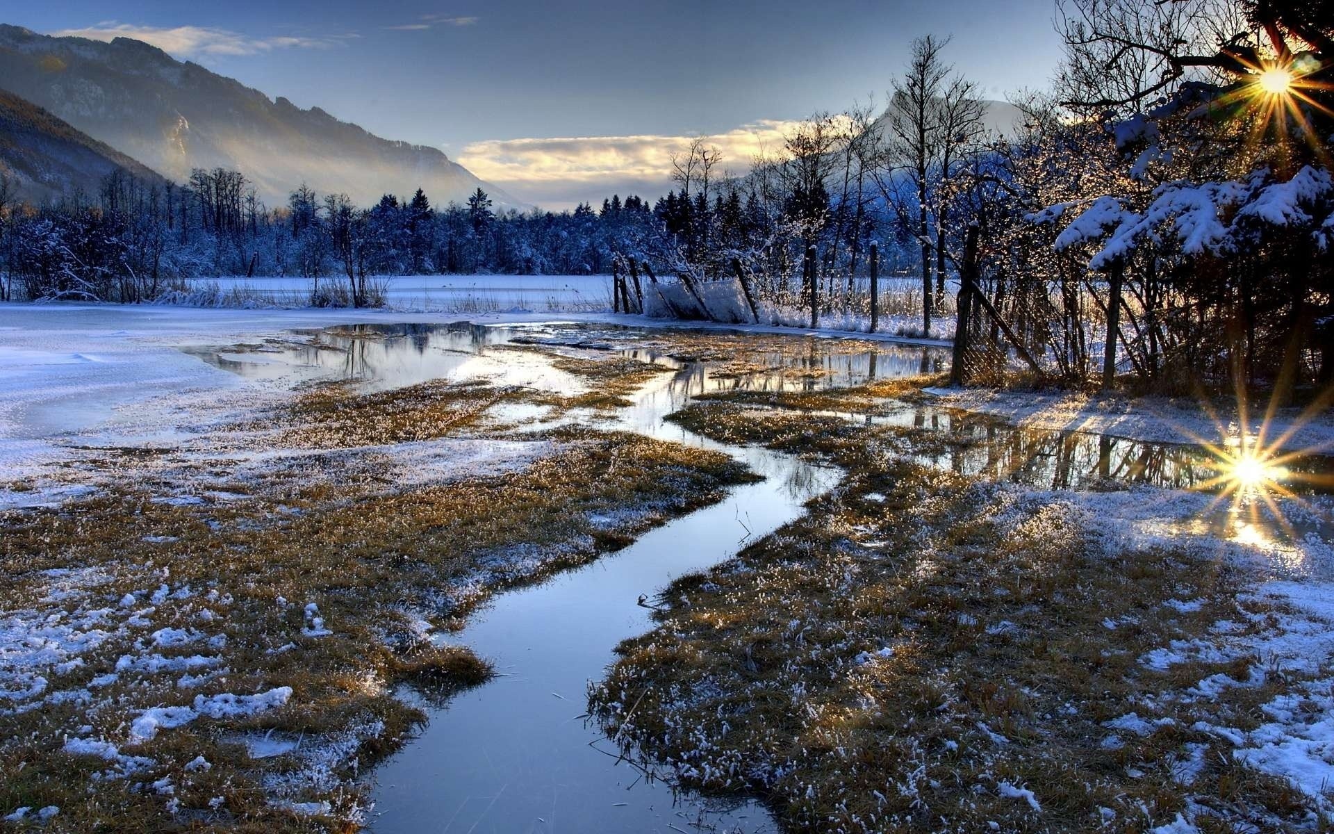 Winter landscape with frozen lake and stream at sunrise HD Wallpaper