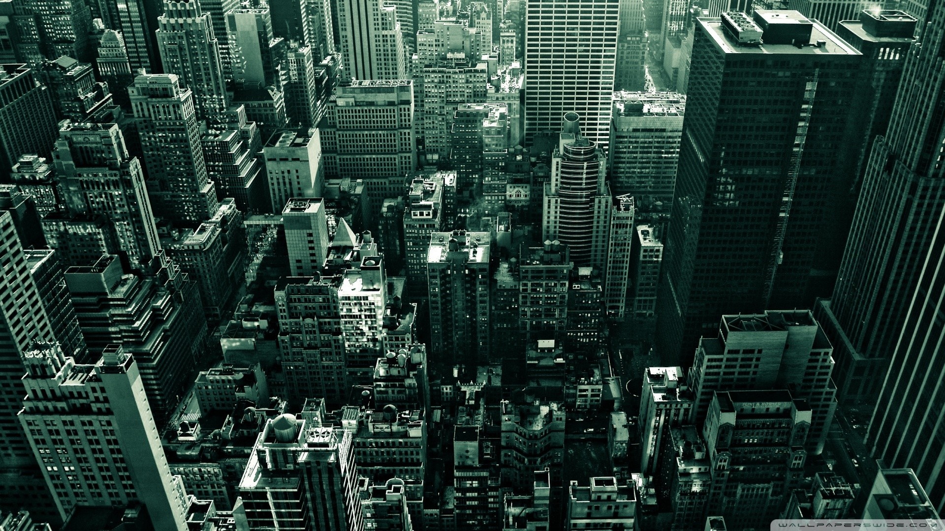Aerial view of a dense urban cityscape with skyscrapers HD Wallpaper