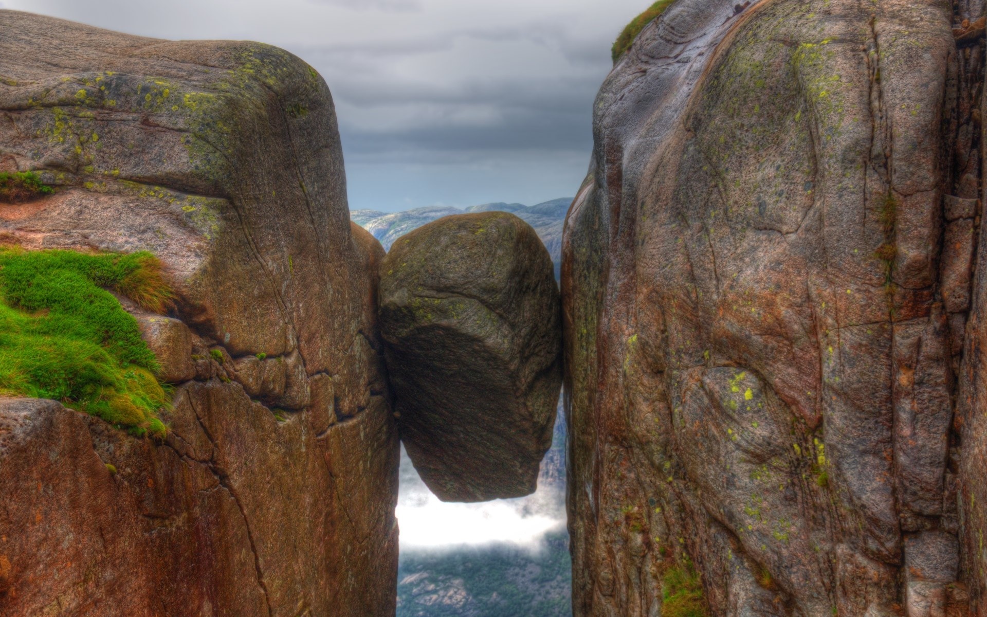 Kjeragbolten boulder wedged between cliffs in Norway HD Wallpaper