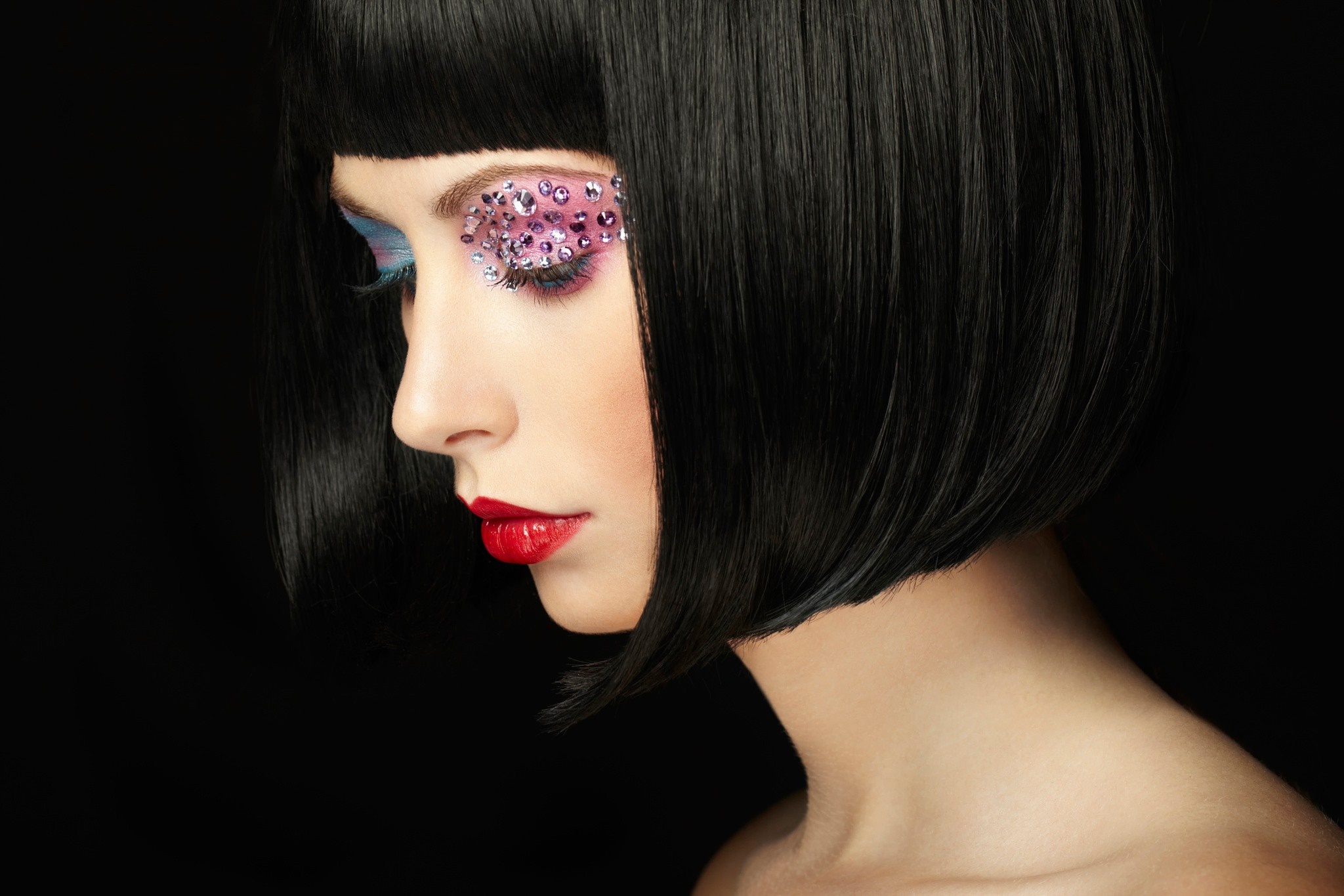 Woman with black bob haircut and dramatic makeup HD Wallpaper