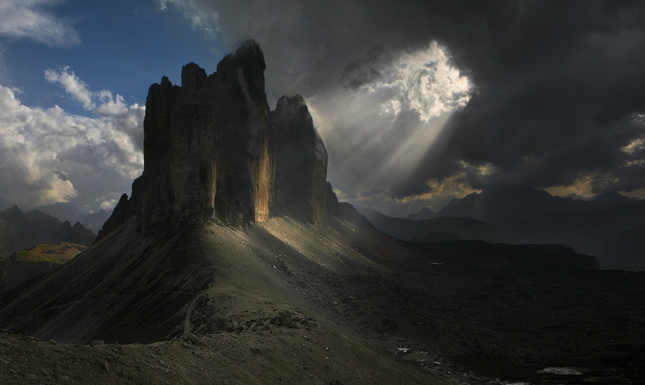 Sunlight Beaming Through Clouds Over Dolomites Mountains HD Wallpaper