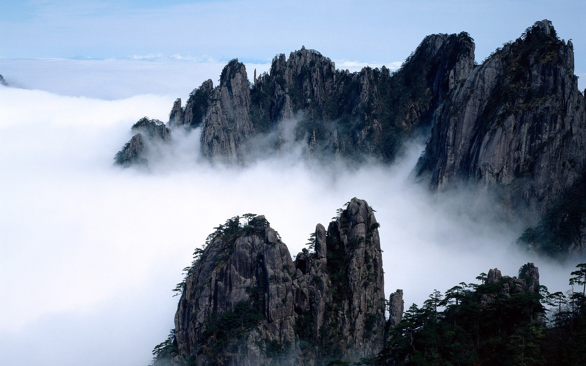 Huangshan Mountains shrouded in clouds, China HD Wallpaper