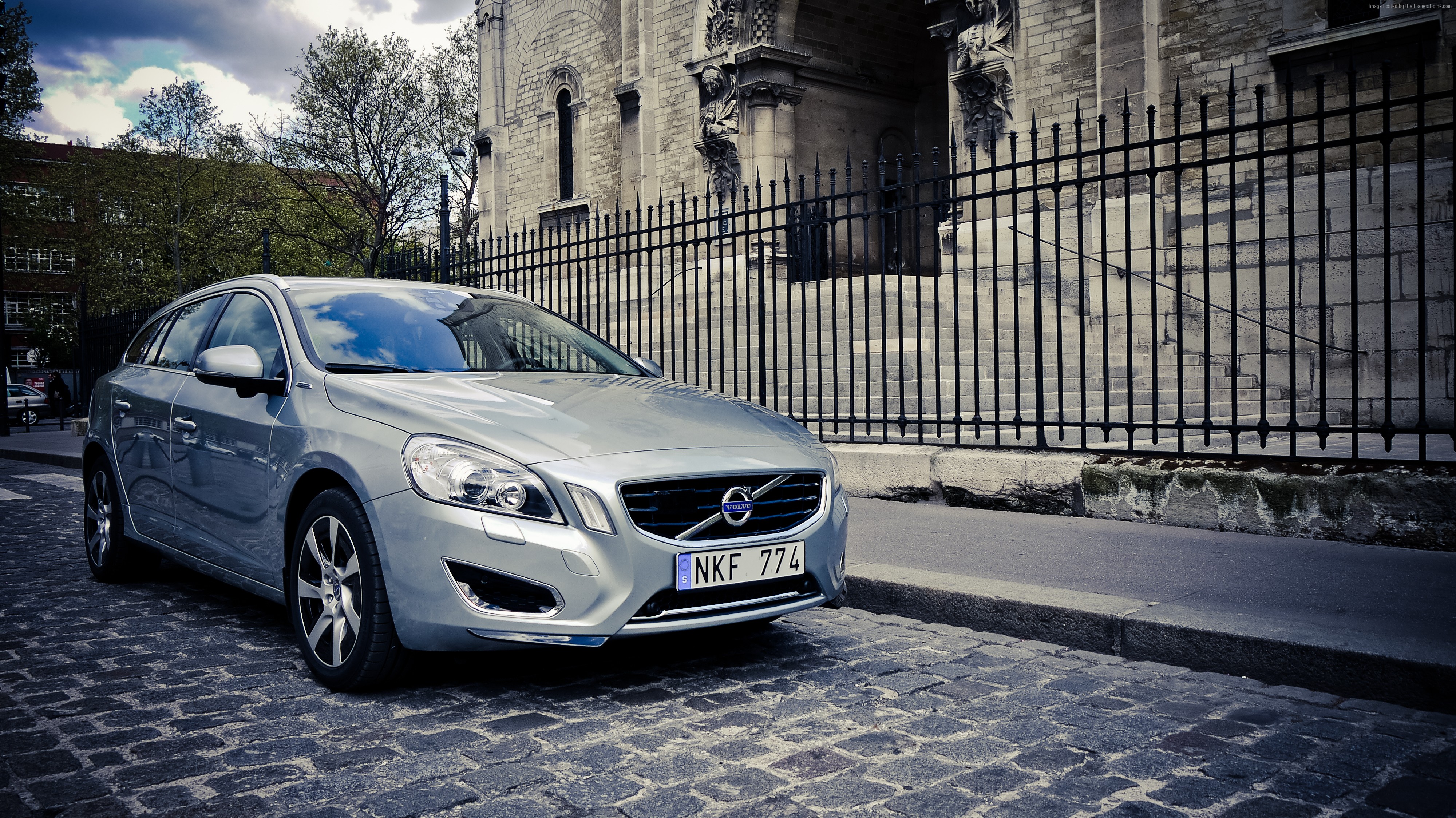 Silver Volvo V60 parked on cobblestone street HD Wallpaper