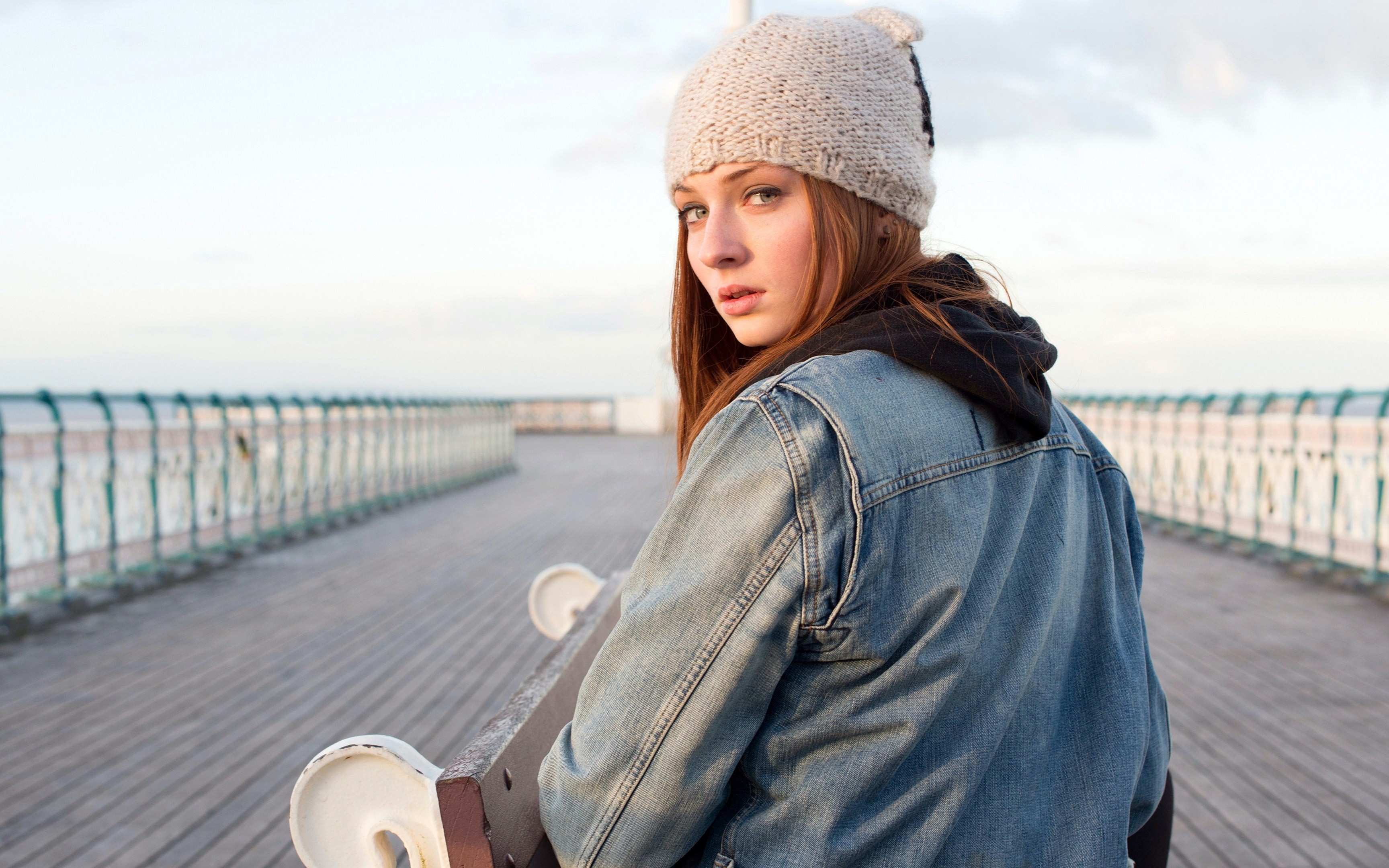 Sophie Turner wearing a denim jacket and beanie HD Wallpaper