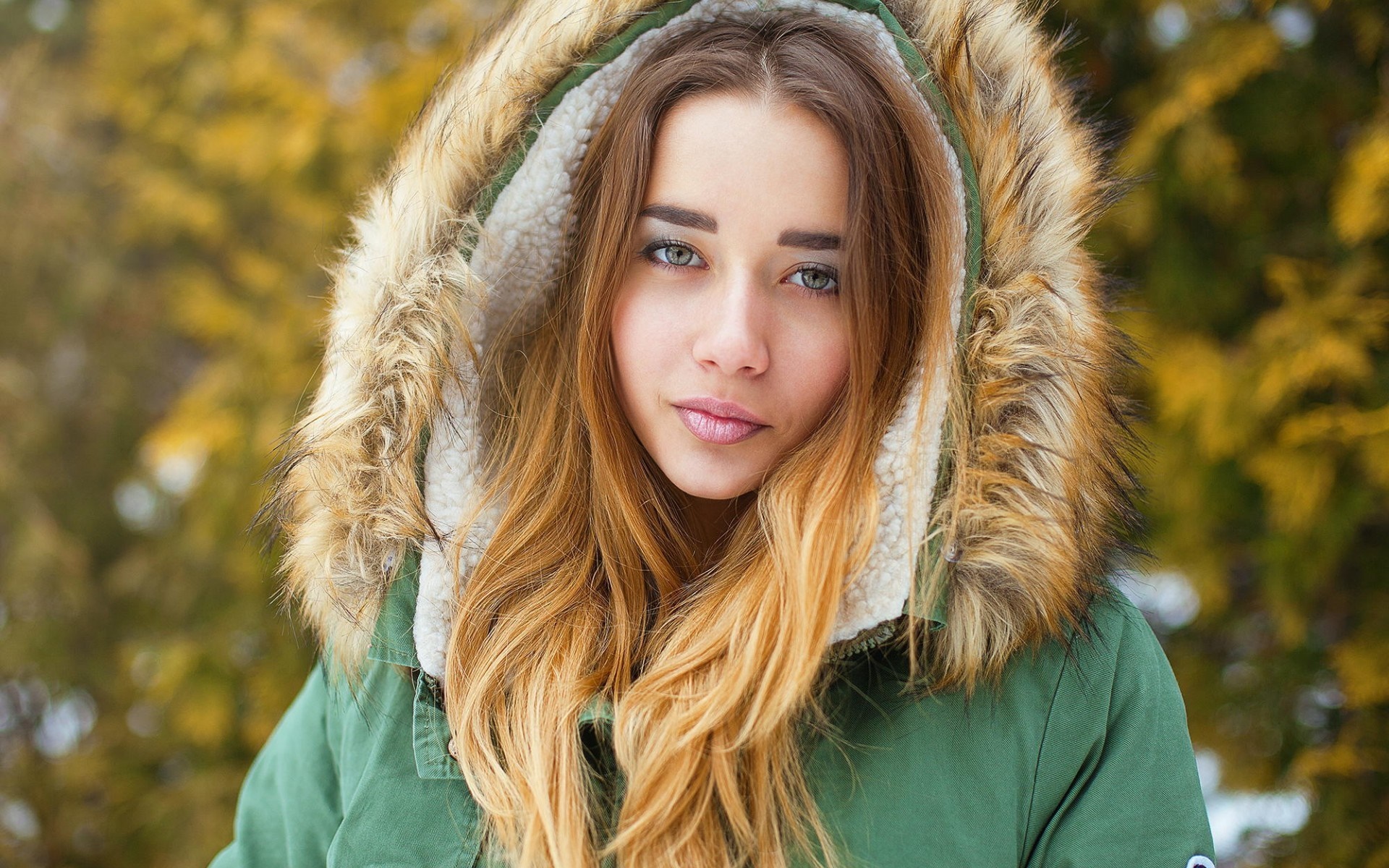 Woman in a fur-lined hooded jacket HD Wallpaper