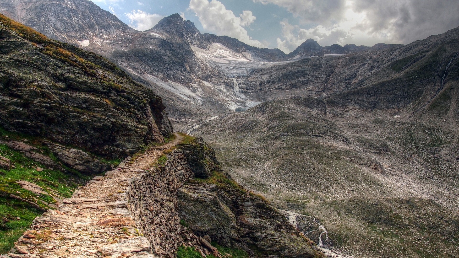 Mountain trail with glacier and rocky slopes HD Wallpaper
