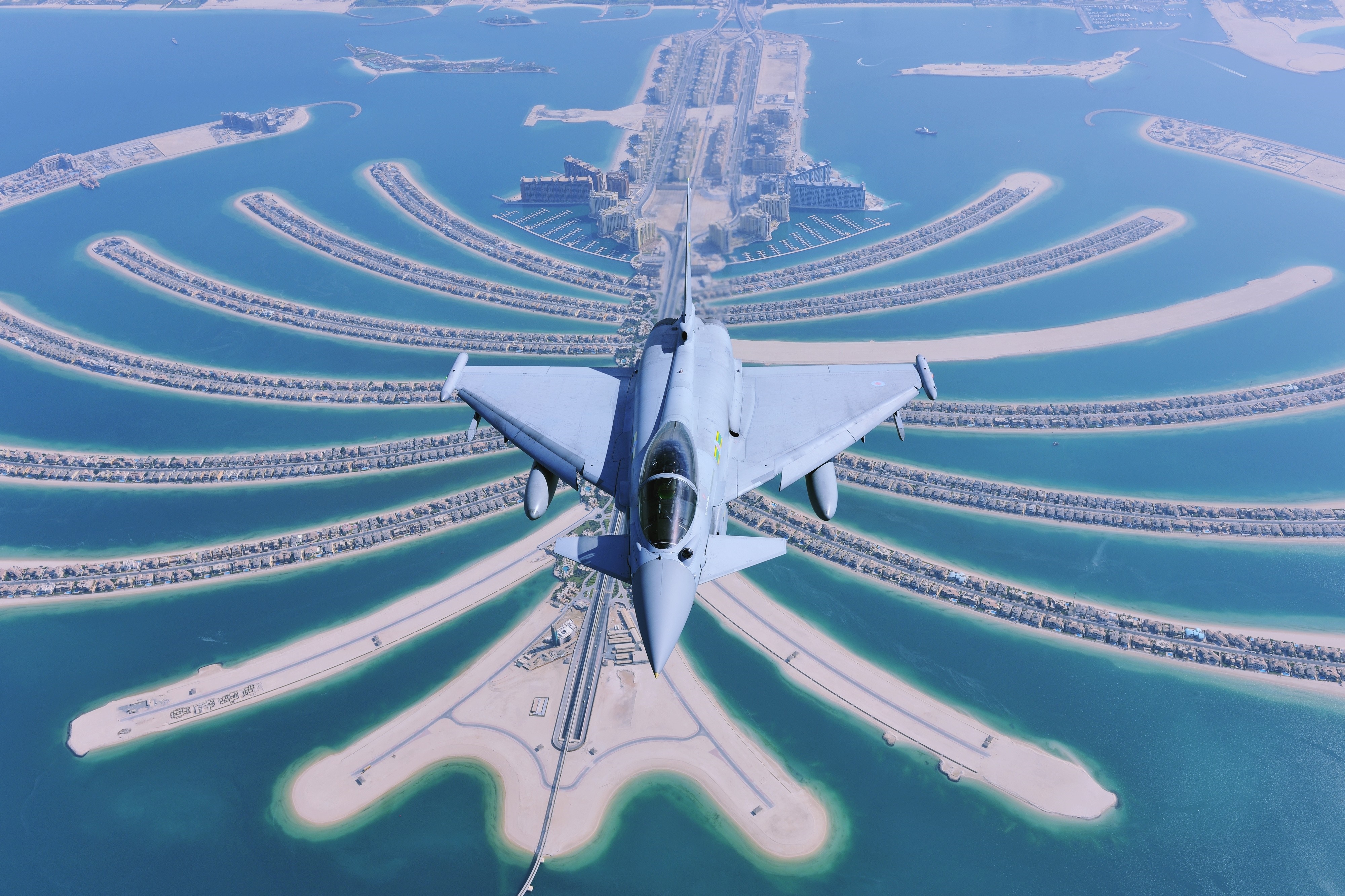 Fighter jet flying over Palm Jumeirah, Dubai HD Wallpaper