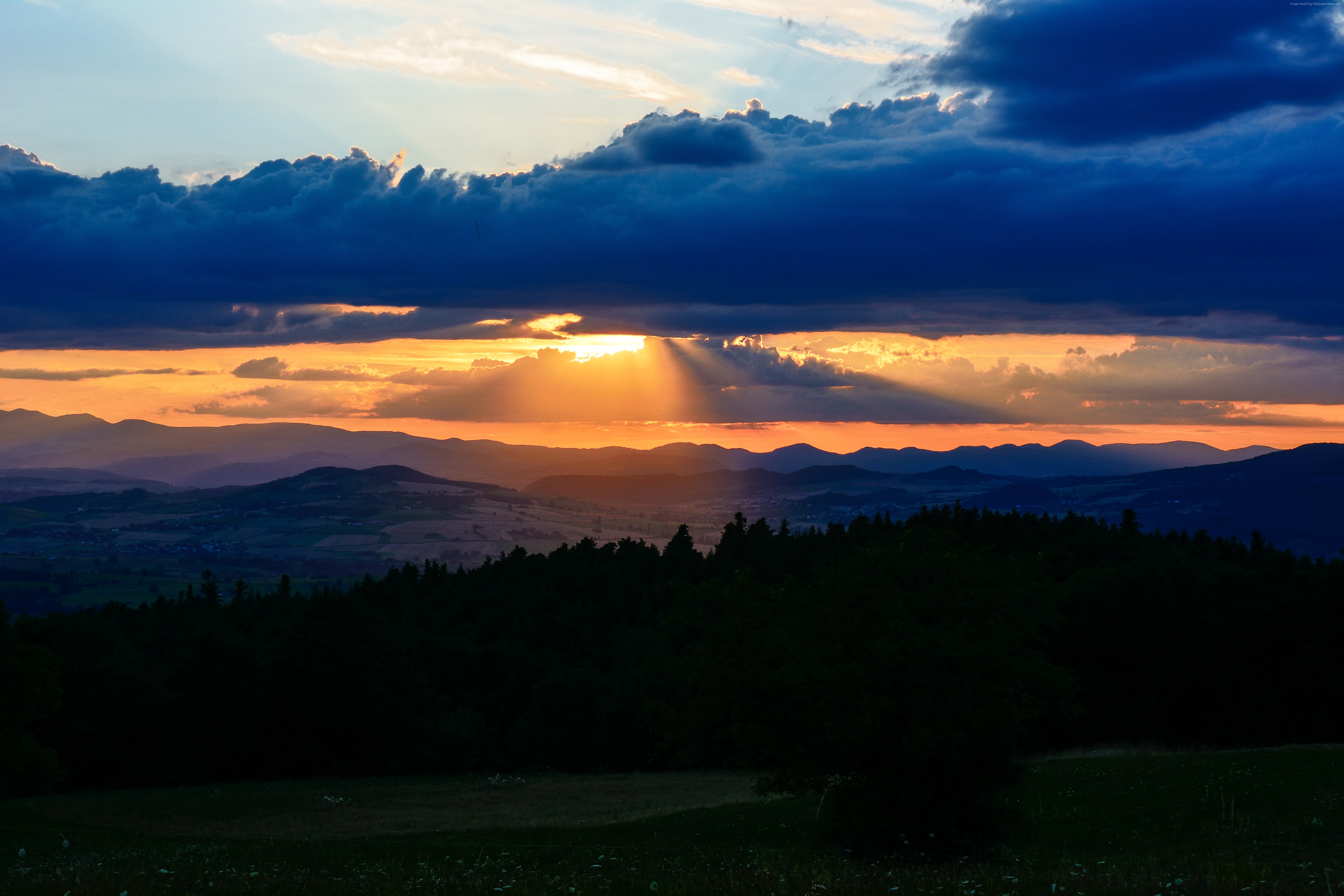 Sunset over mountains with dramatic clouds HD Wallpaper