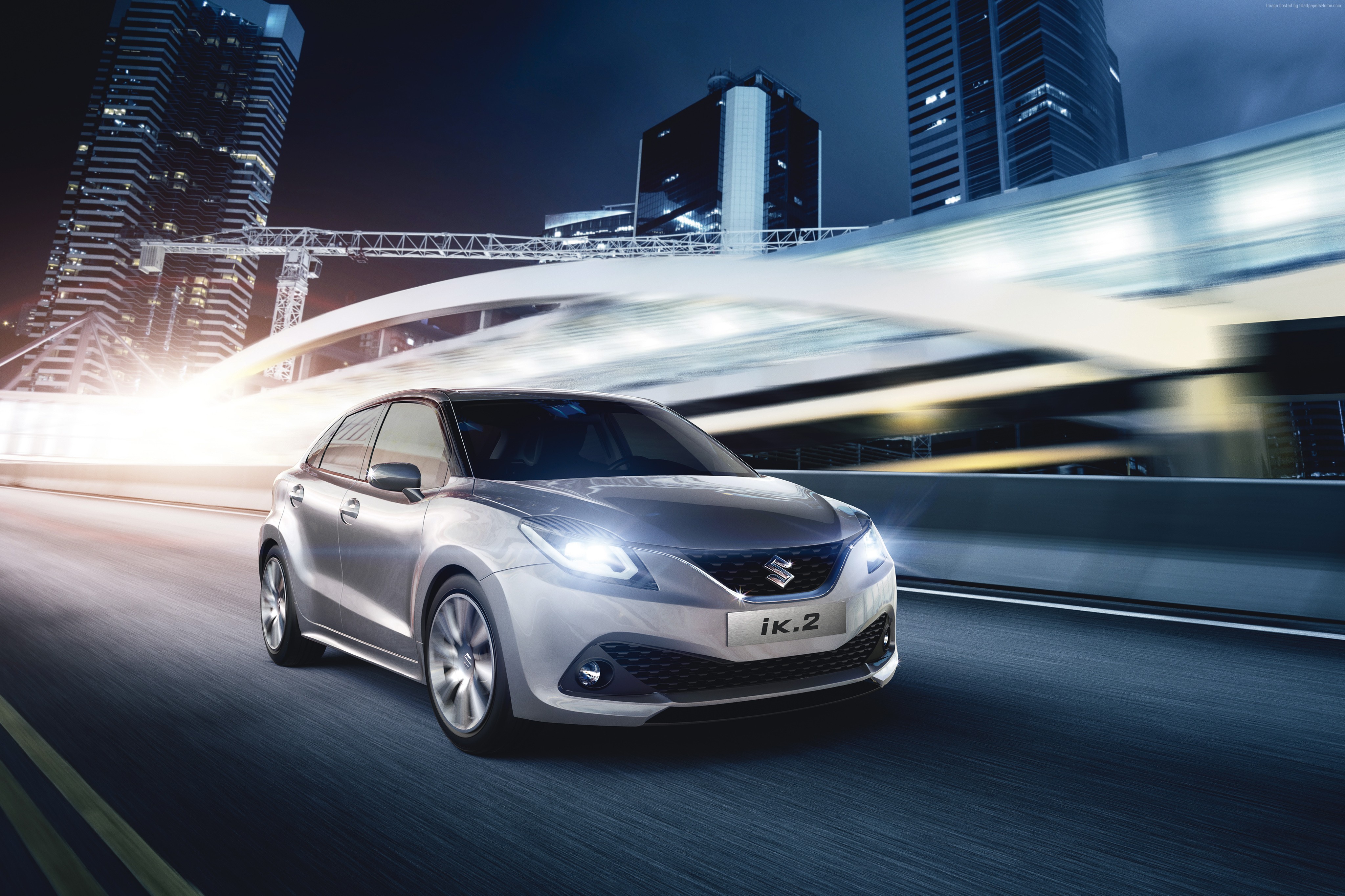 Suzuki IK2 concept hatchback driving in city at night HD Wallpaper