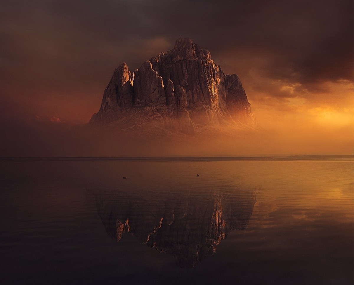 Mountain reflected in water at sunset HD Wallpaper