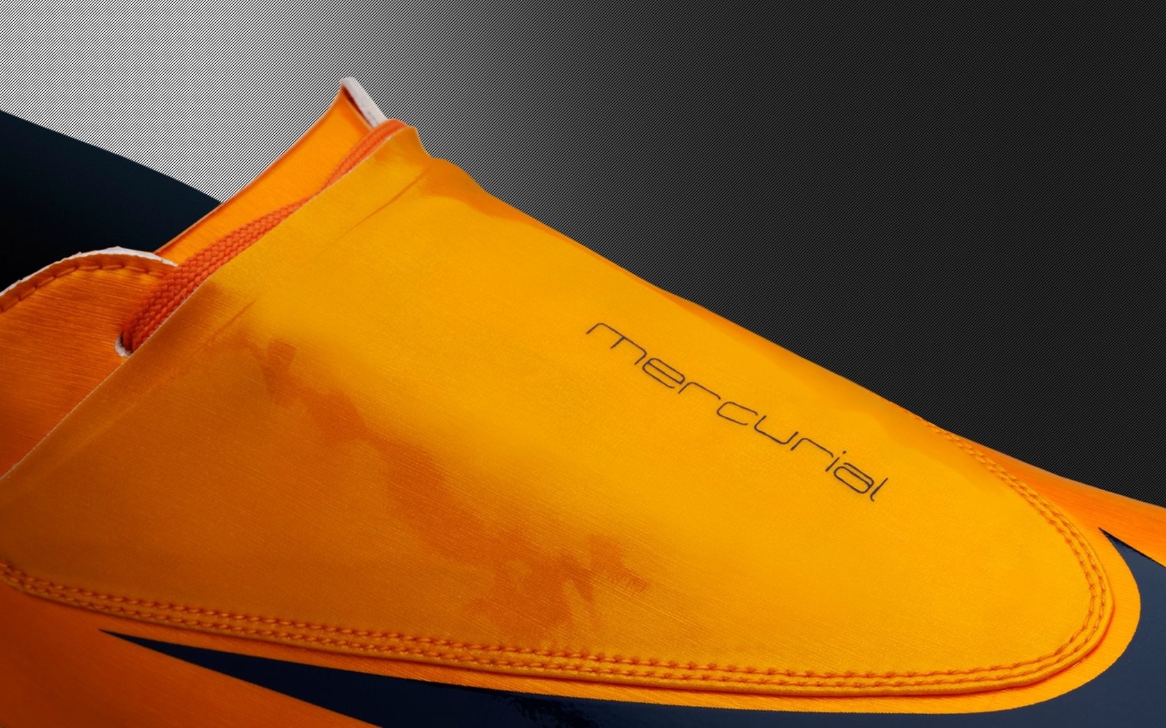 Nike Mercurial orange soccer cleat close-up HD Wallpaper