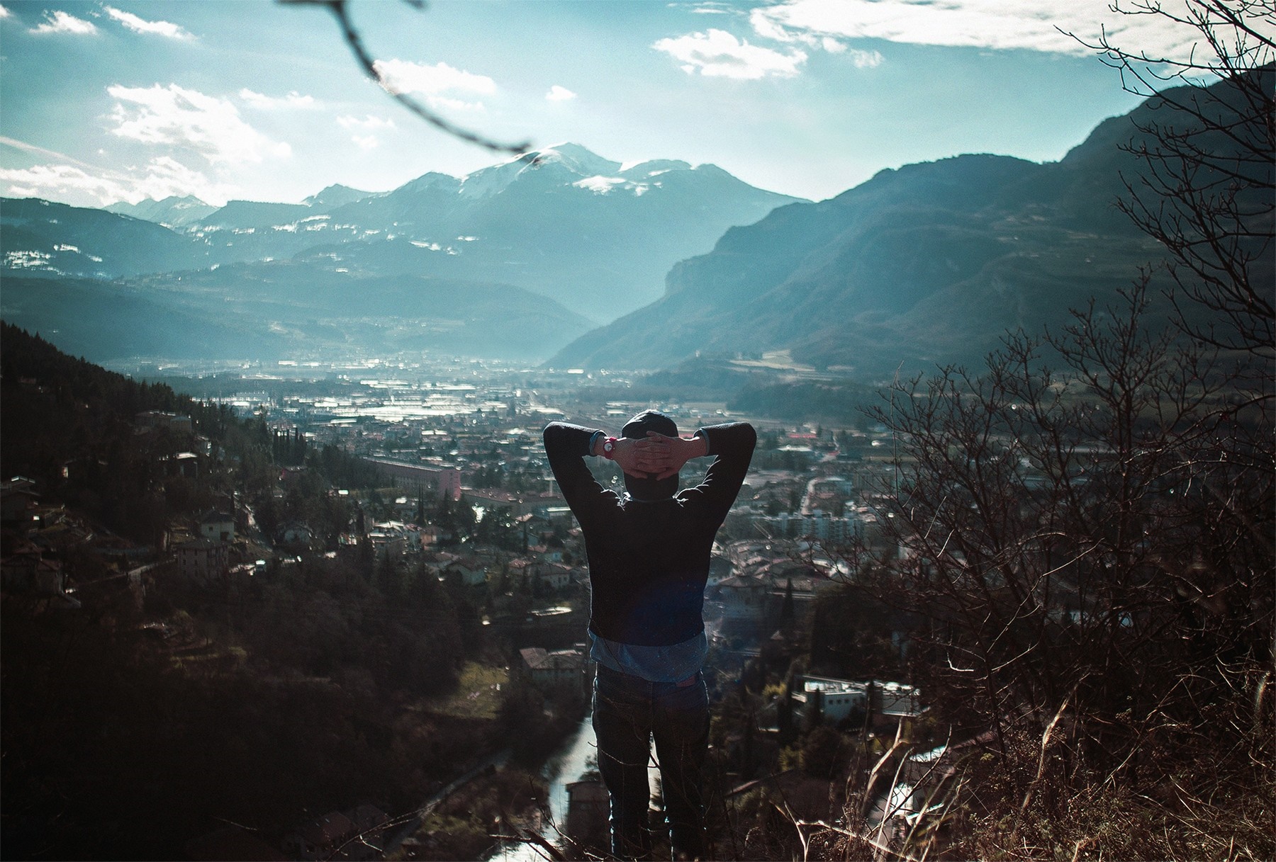 Man overlooking a valley and mountains HD Wallpaper